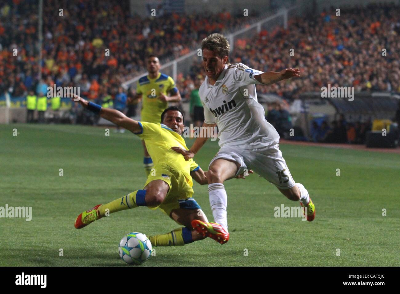 SAvas Poursaitides and Fabio Coentro during the UEFA Champions League quarter final match between Apoel and Real Madrid at GSP stadium on 27th of March in Nicosia, Cyprus Stock Photo