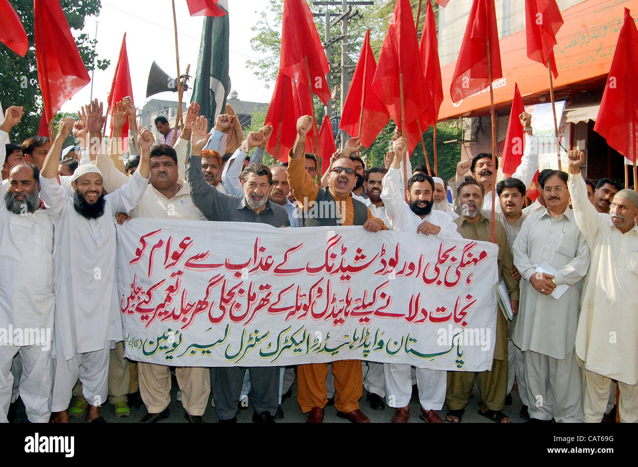 Members of WAPDA Hydro Electric Central Labor Union chant slogans against increase in electricity price and in favor of their demands during protest demonstration in Lahore on Wednesday, April 18, 2012. Stock Photo