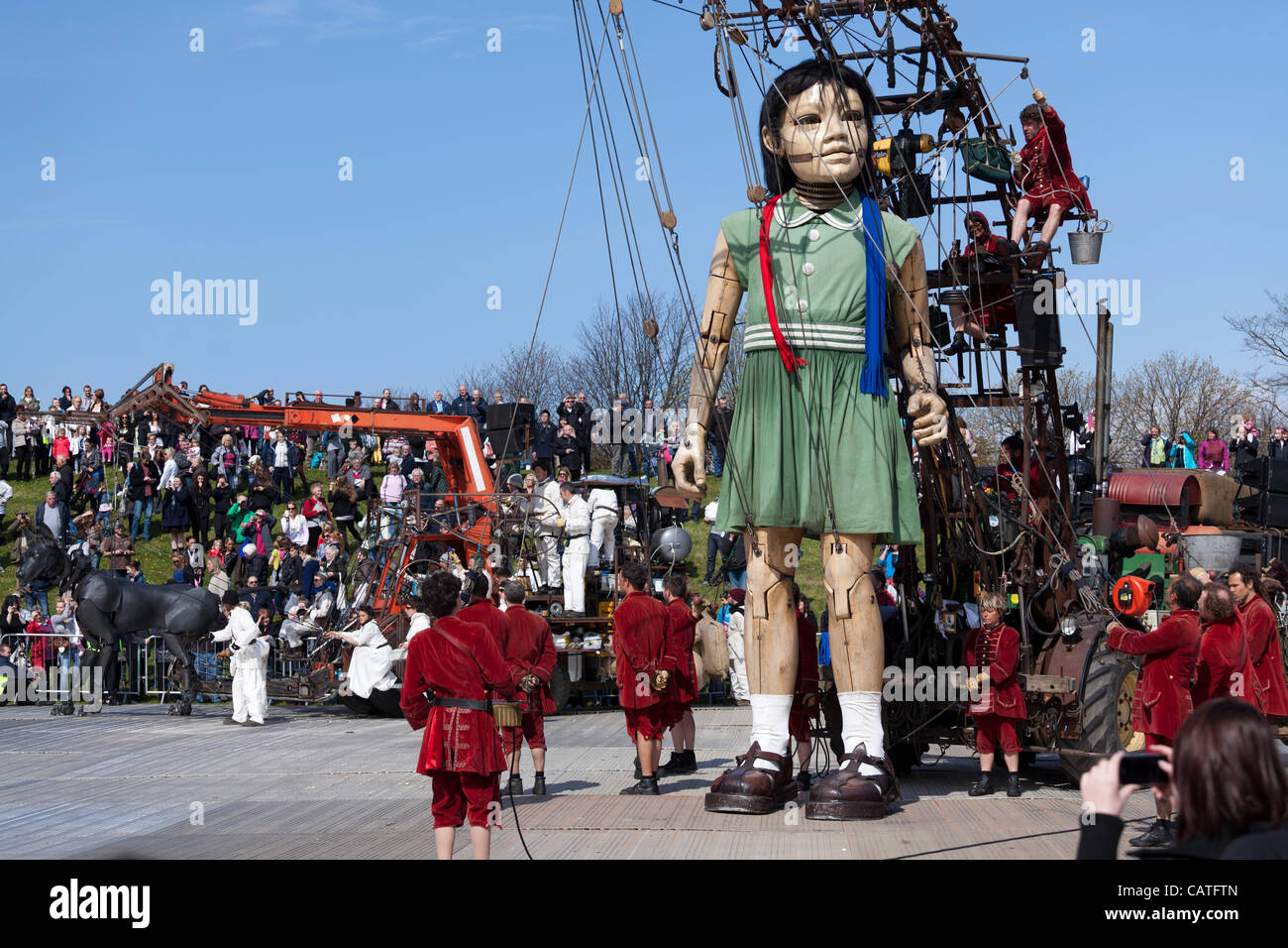Liverpool, UK, Friday 20th April, 2012. The giant little girl puppet starts her walk around the city on the first of a 3 day event 'Sea Odyssey-Giant Spectacular'. The event helps to commemorate the sinking of the Titanic’s 100 year anniversary. Stock Photo