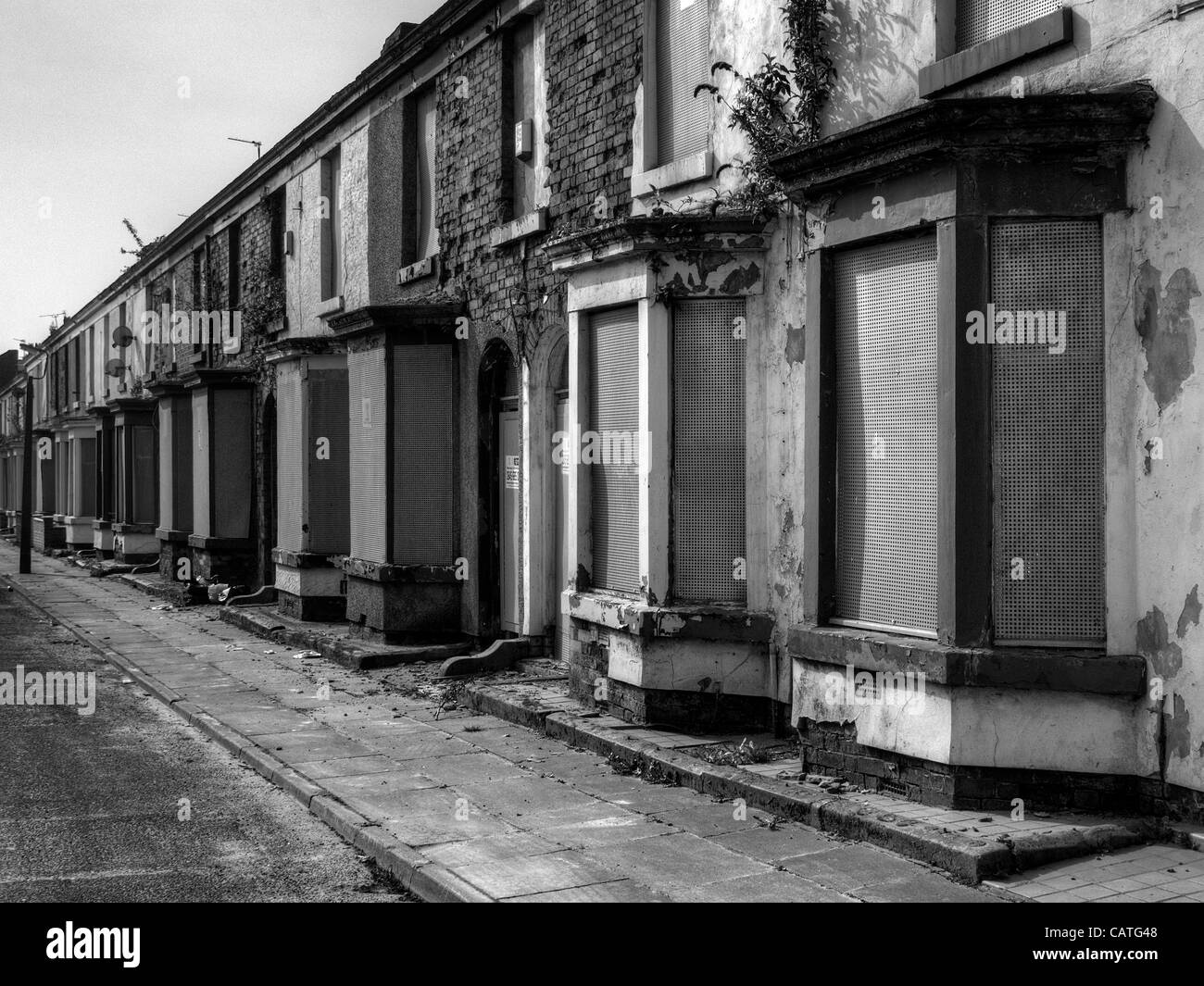 Abandoned Liverpool city terrace house street prior to regeneration program to make way for new housing development Stock Photo