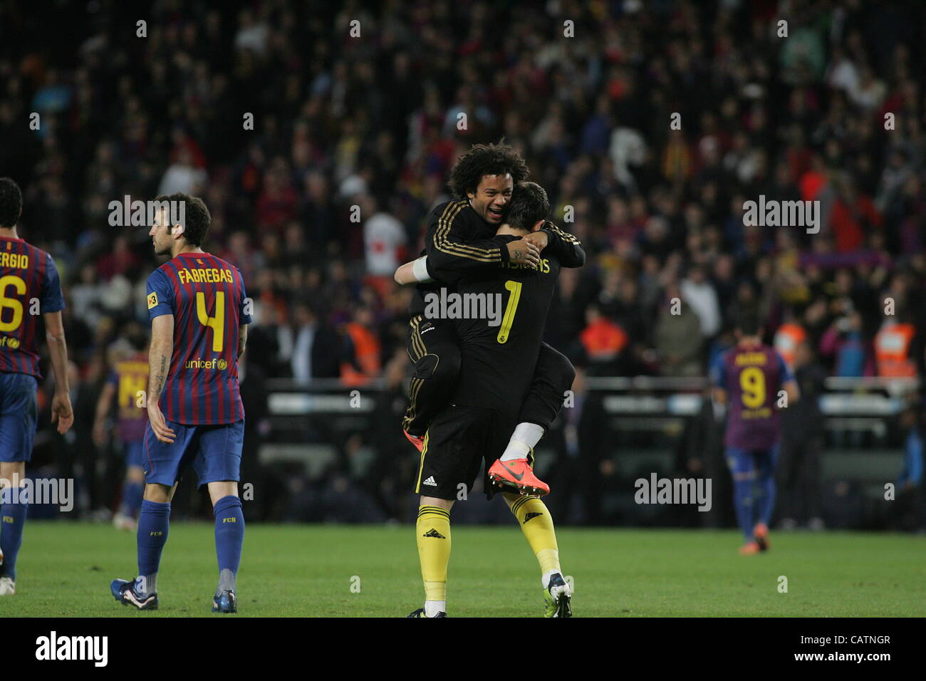 21.04.2012 Barcelona, SPAIN - La Liga match played between F.C. Barcelona vs Real Madrid (1-2) at Nou Camp stadium. the picture shows Iker Casillas (spanish goalkeeper of Real Madrid) and  Marcelo Vieira (Brazilian defender of Real Madrid) celebrating his team's victory Stock Photo