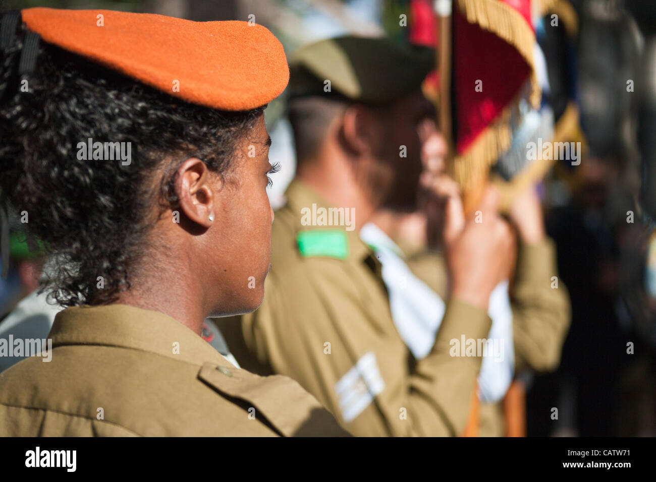 IDF soldiers of all units and beret colors take part in a pre-Memorial Day  ceremony in which small flags at half-mast with black ribbons symbolizing  grief are placed on the graves of