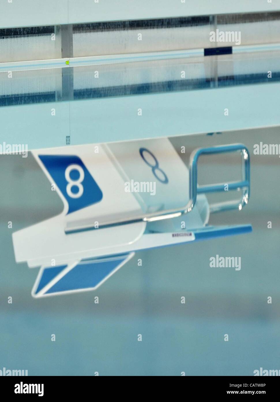 AQUATICS CENTRE, OLYMPIC PARK, LONDON, UK, Sunday. 22/04/2012. Omega Starting Block number eight (8) reflected in the pool water. London Prepares Series. FINA Synchronised Swimming Olympic Qualification. Stock Photo
