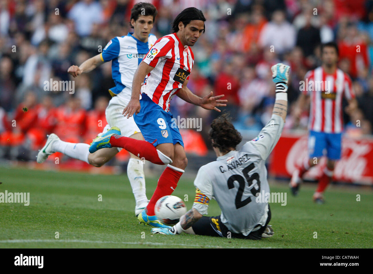 22.04.2012 MADRID, SPAIN - La Liga game  At. Madrid versus  R.C.D. Espanyol (3-1) at Vicente Calderon stadium. Picture  shows Radamel Falcao Garcia (Colombian striker of At. Madrid) and Cristian Dario Alvarez (Goalkeeper of Espanyol)  Athletico ran out winners by a score of 3-1. Stock Photo