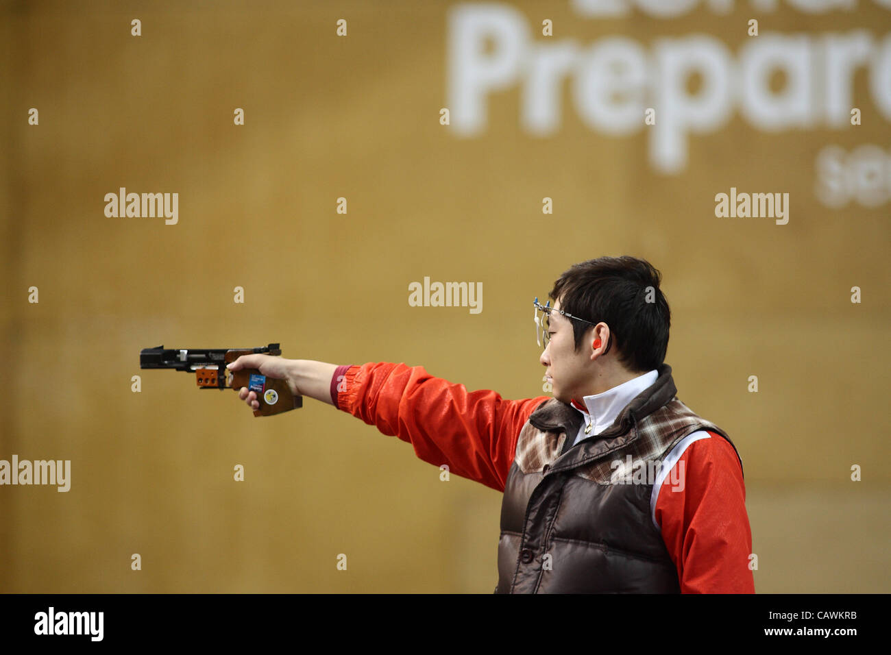 27.04.2012 London, England. Ding Feng (CHN) in action during the final of the mens 25m Rapid Fire Pistol competition. Stock Photo