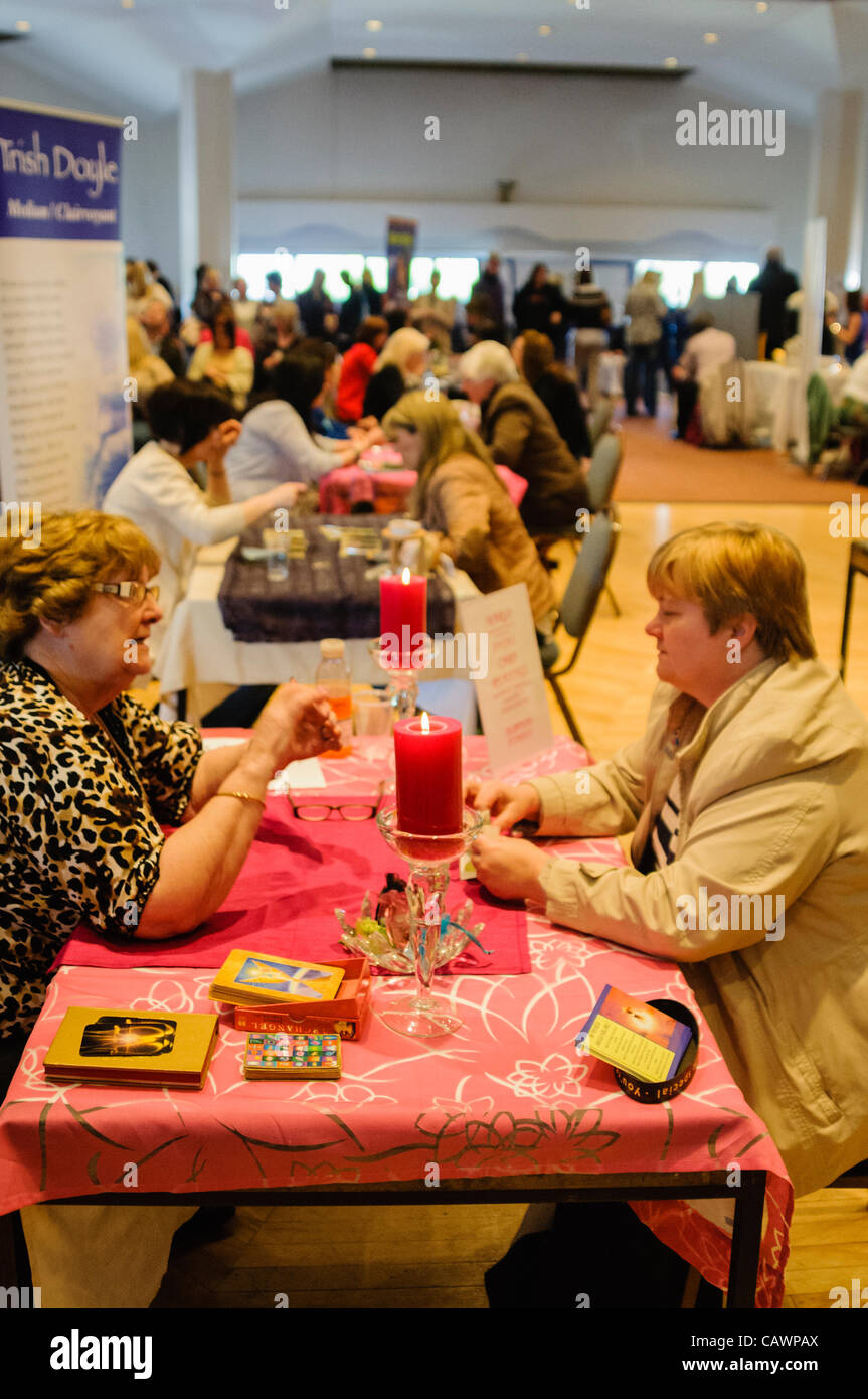 People receive spiritual readings at a New Age Psychic and Holistic Fair Stock Photo