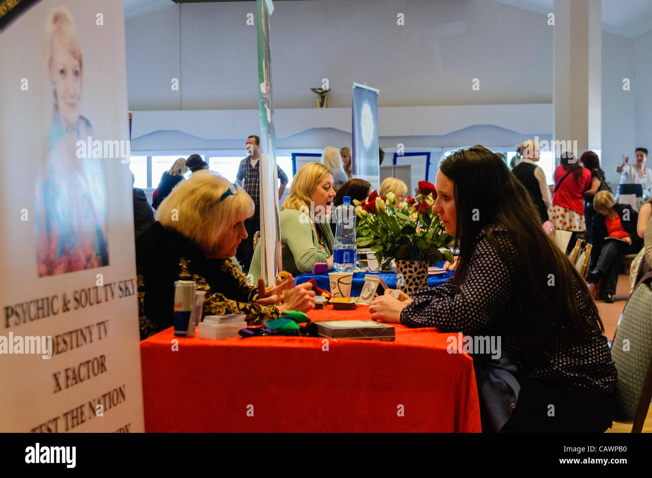 People receive spiritual readings at a New Age Psychic and Holistic Fair Stock Photo