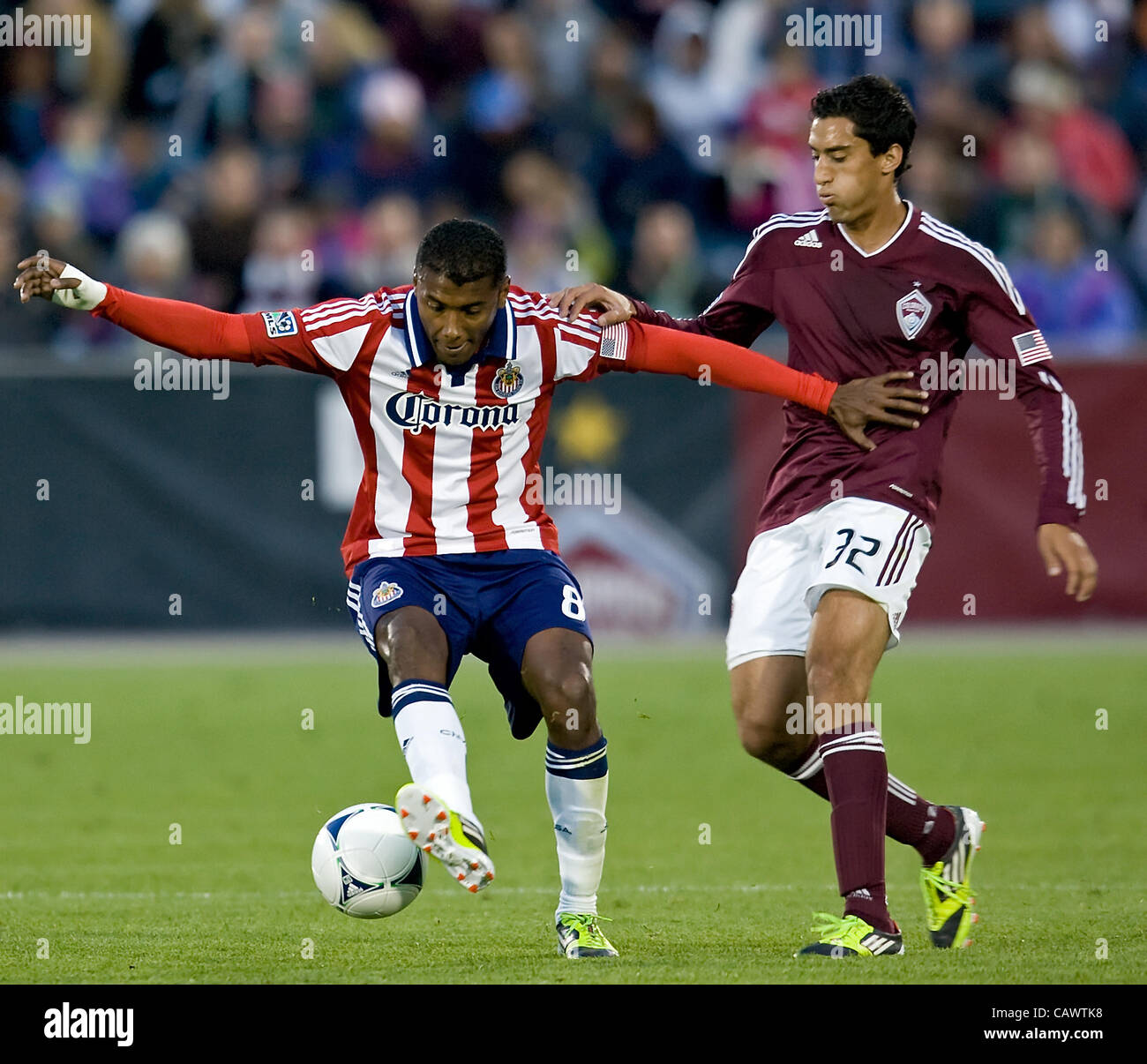 April 28, 2012 - Commerce City, CO, USA - OSWALDO MINDA, left, of Chivas USA fights for control of the ball with TONY CASCIO, right, of the Colorado Rapids in the 1st. half at Dicks Sporting Goods Park Saturday night. The Rapids defeat Chivas USA 4-0. (Credit Image: © Hector Acevedo/ZUMAPRESS.com) Stock Photo