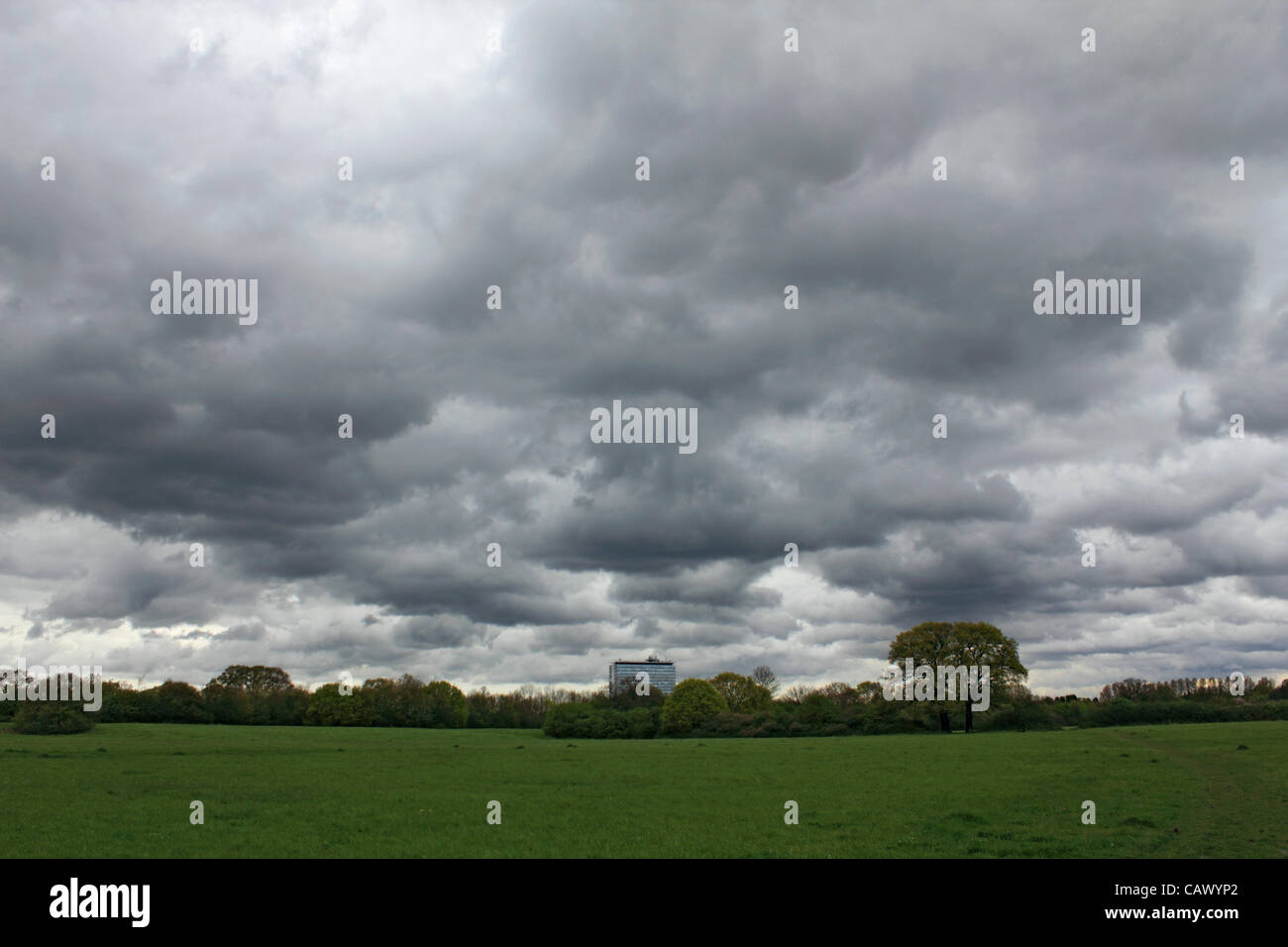 As the April showers continue across Britain, more stormy weather at Tolworth Court Farm, green belt land in South West London, England, UK Stock Photo