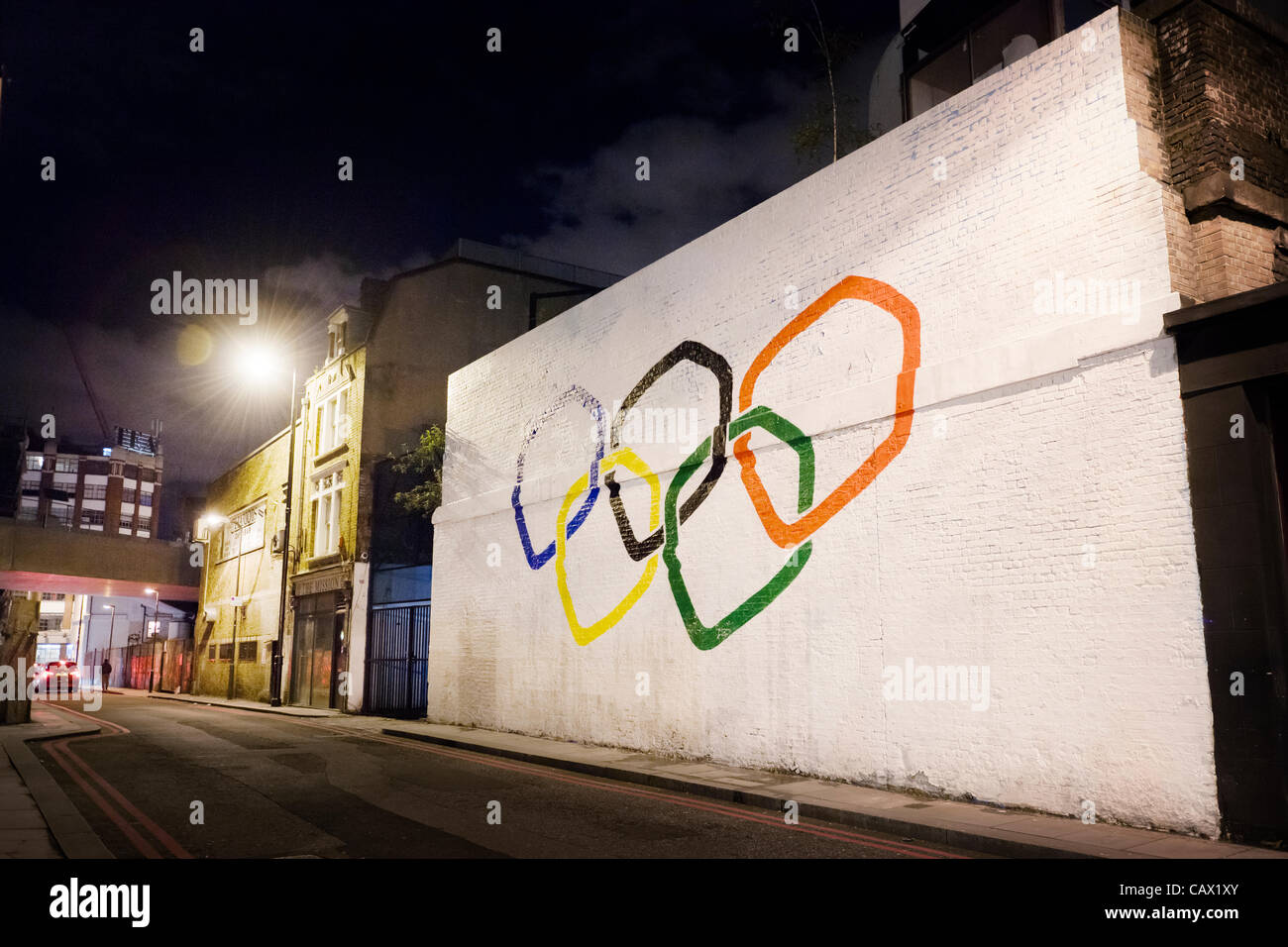 The Olympic rings painted on a wall by a street art organisation called 'The Toasters' in Holywell Lane, Shoreditch, London, UK, on the 29th of April 2012. Stock Photo