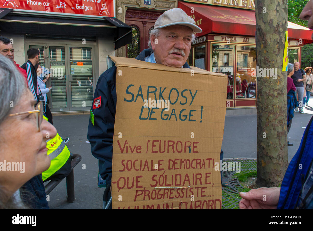 Paris, France, French Labor Unions Demonstrate in Annual May Day March, Man Holding Anti-Sarkozy Sign, protests Stock Photo