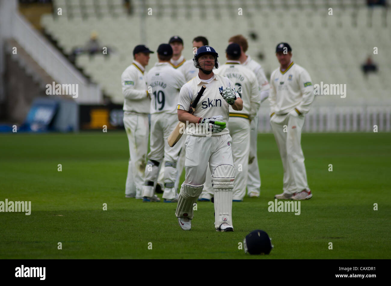 02.05.2012 Birmingham, England. Warwickshire v Durham County. Darren Maddy leaves the field as Phil Mustard celebrates his catch  during the LV County Championship match played at Edgbaston. Stock Photo