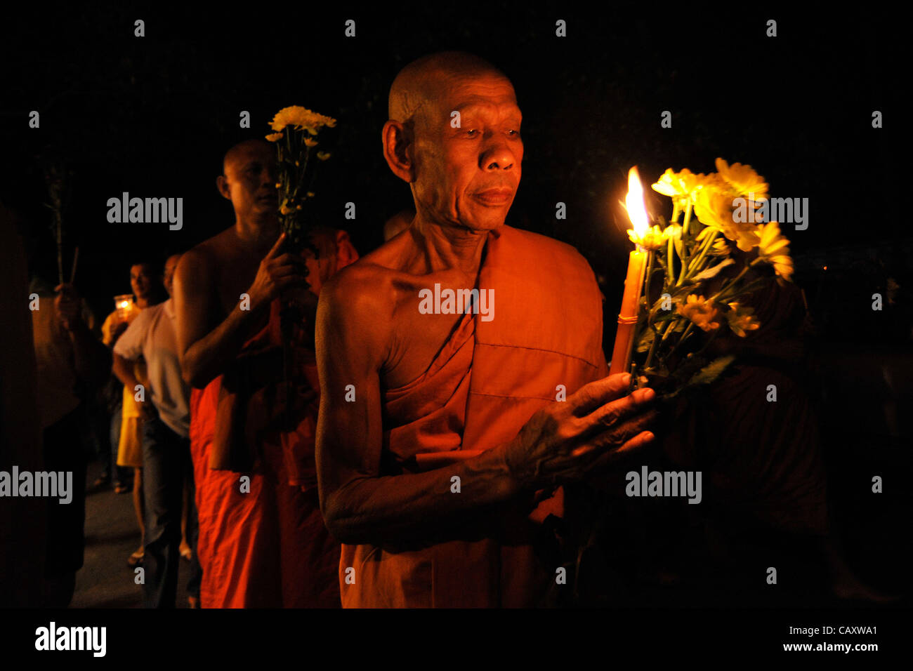May 5, 2012 Kuala Lumpur, Malaysia A Buddhist monk carries flowers