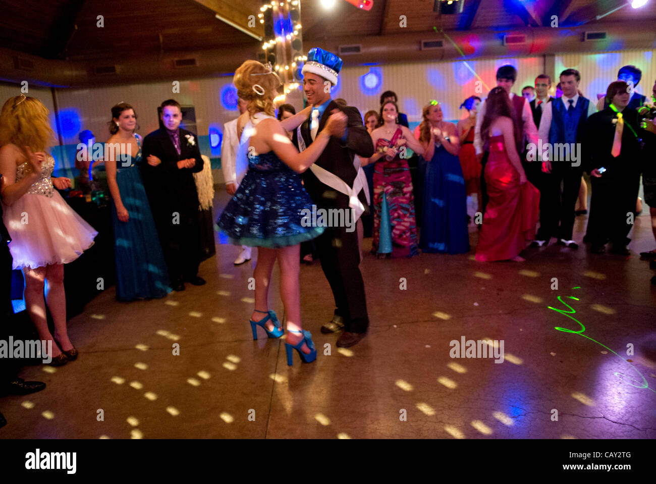 May 5, 2012 - Roseburg, Oregon, U.S - The King and Queen of the Glide (Ore.) High School prom share their first dance as other students watch during their prom in a building at the Douglas County Fairgrounds in Roseburg. The rural school in southwestern Oregon has about 300 students. (Credit Image:  Stock Photo