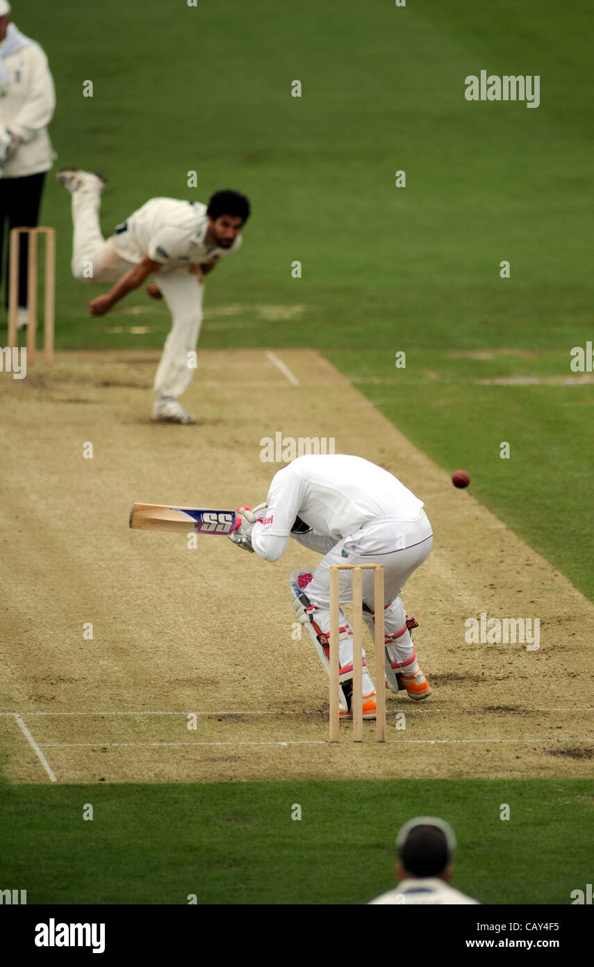 Hove UK - Sussex bowler Amjad Khan bowls a bouncer which has West Indies batsman Darren Bravo ducking at the Probiz County Ground today during their three day nmatch which has been badly affected by the weather 7 May 2012 Stock Photo
