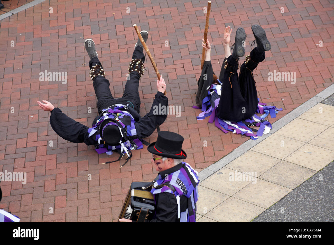 Poole, Dorset, UK Bank Holiday Monday 7 May 2012. Poole Street Arts Festival 2012 at Poole Quay - Anonymous Morris entertaining Stock Photo