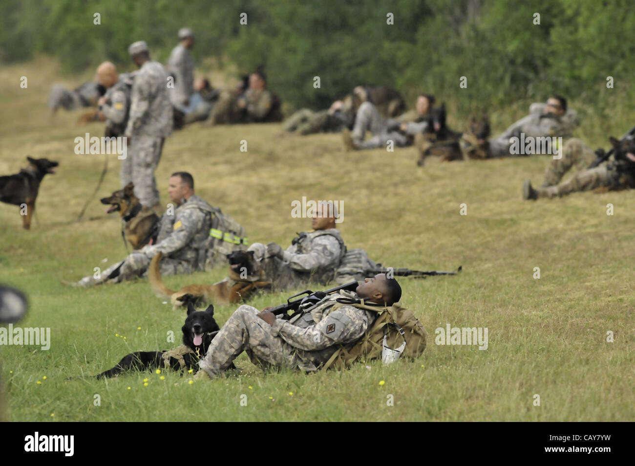 May 5, 2012 Sgt. Elizabeth Wenke hugs her dog following the Iron Dog