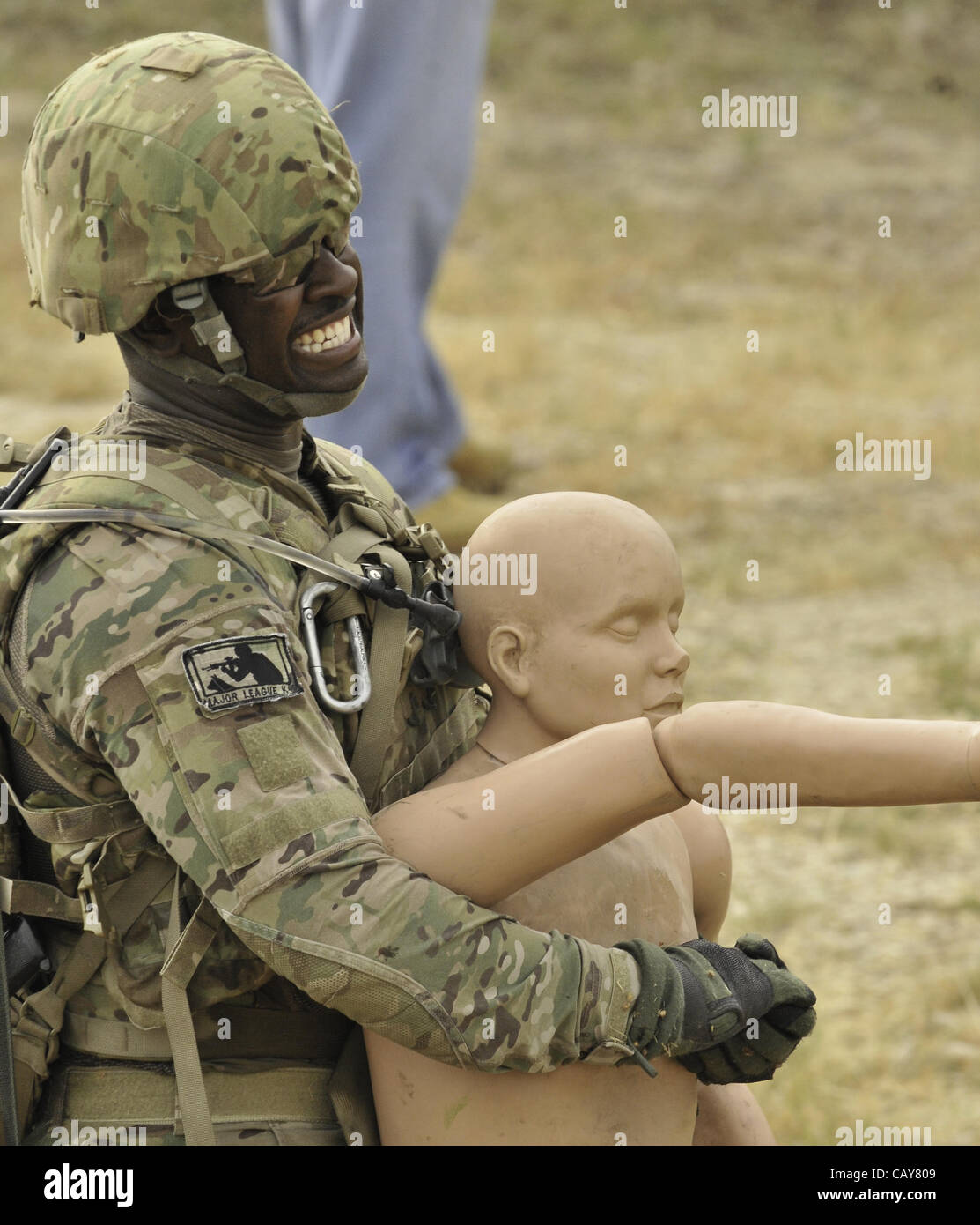 May 5, 2012 - DoD K9 Trials-May 4, 2012-Lackland Air Force Base-San Antonio, Texas---A soldier struggles while dragging a weighted dummy during the Department of Defense K9 Trials at Lackland Air Force Base in San Antonio, Texas.  They'll test military working dog teams in a variety of missions, inc Stock Photo