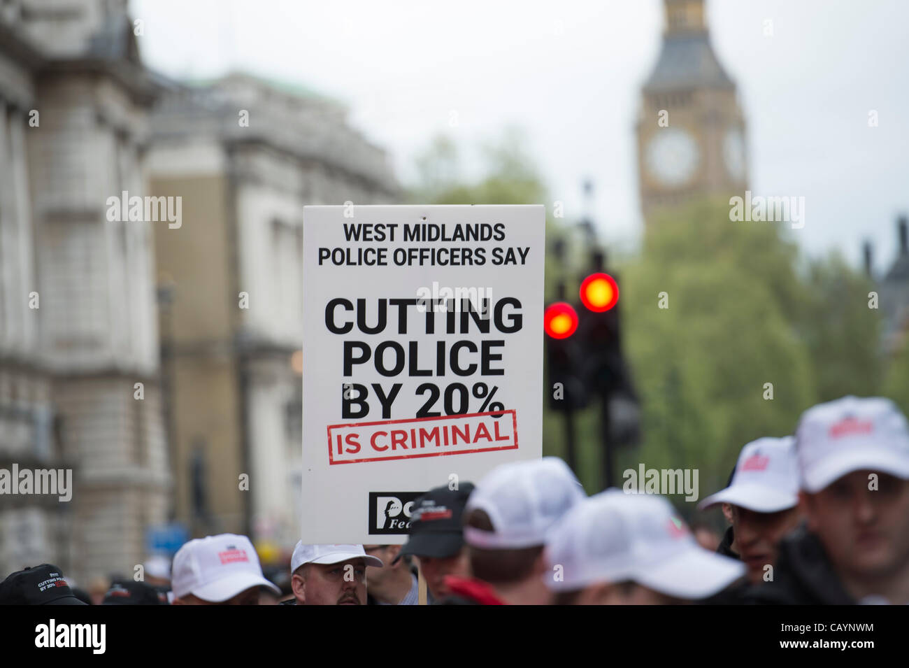 UK police officers marching in central London against the 20 cuts in