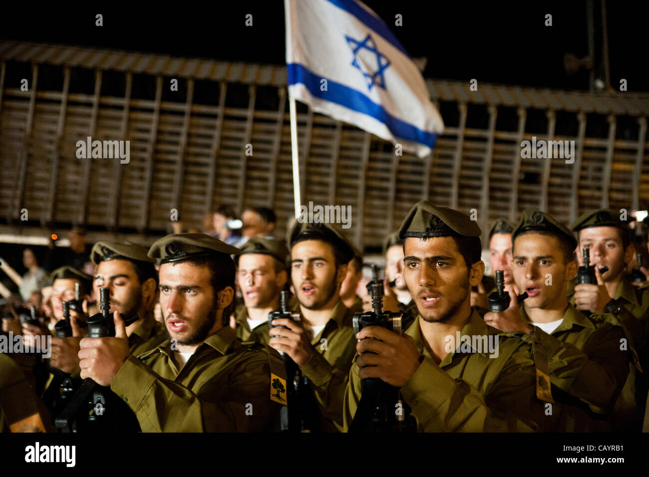 Golani Brigade soldiers sing the ‘Tikva’, the Israeli national anthem, concluding a ceremony at the Western Wall. Jerusalem, Israel. 10-May-2012. Stock Photo