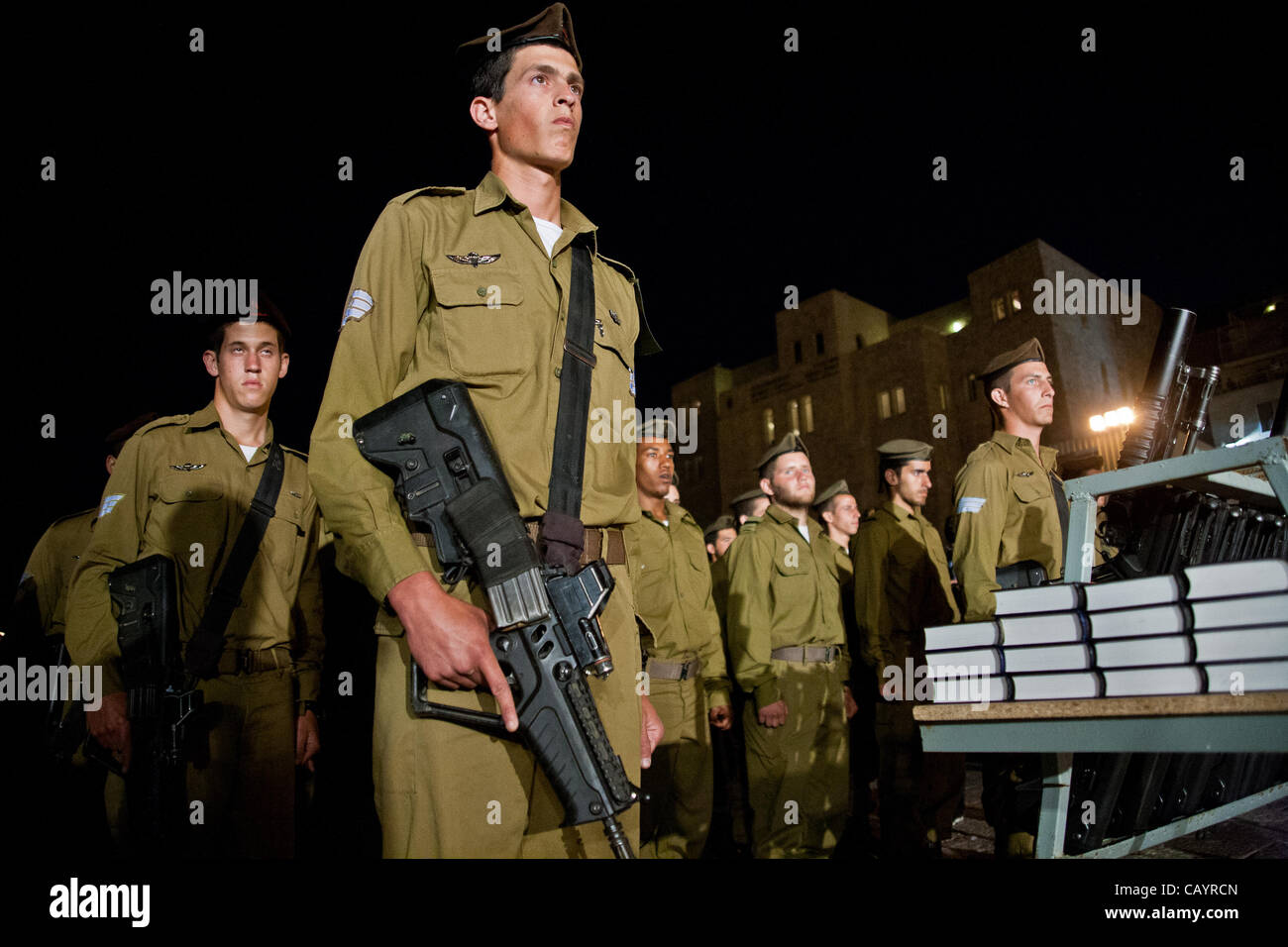 A Golani Brigade IDF sergeant carries an Israeli Military Industry Tavor TAR-21 assault rifle at a ceremony at the Western Wall.  Jerusalem, Israel. 10-May-2012. Stock Photo
