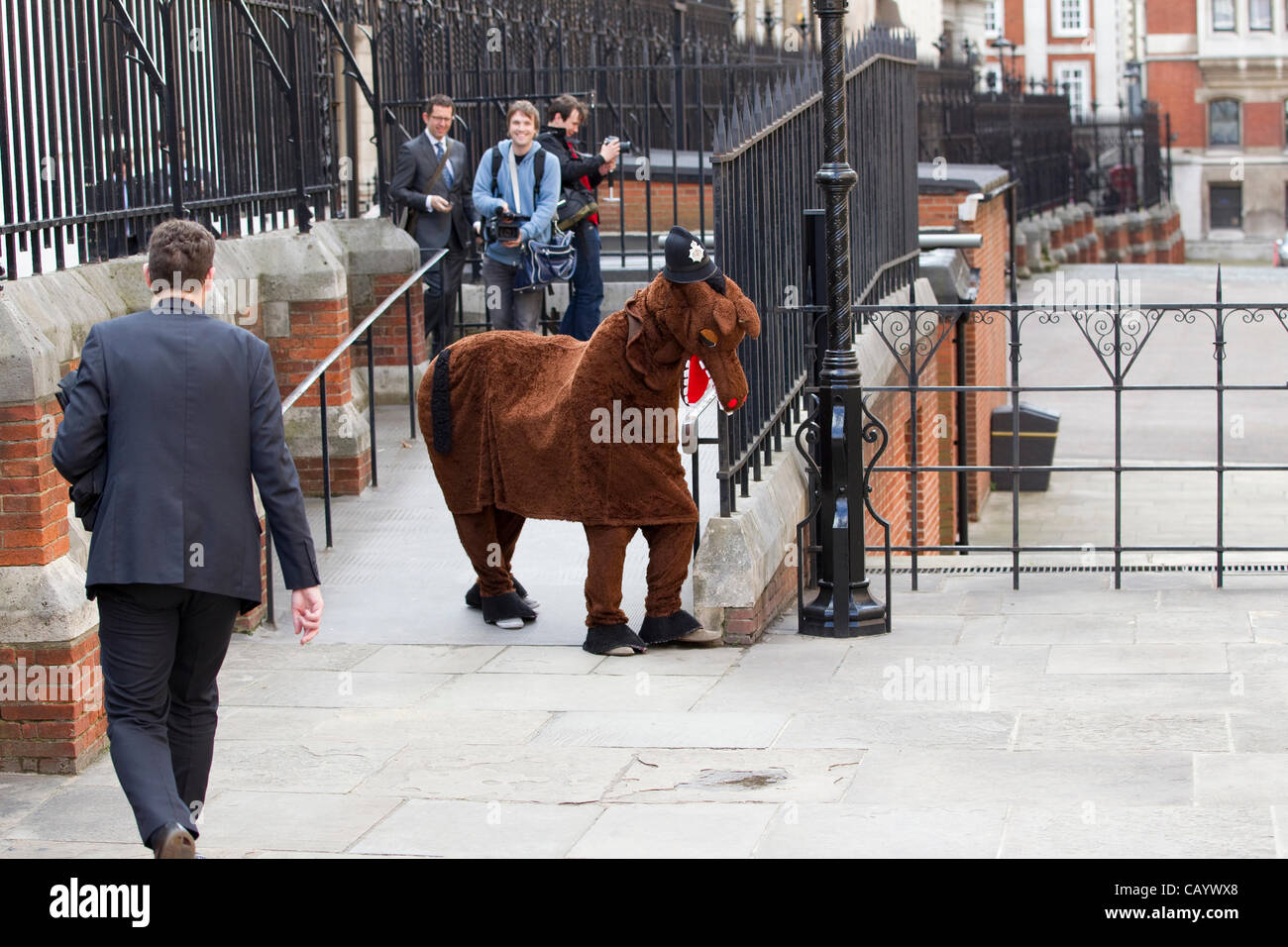 Leveson Inquiry, Royal Courts of Justice, High Court, London, UK. 11.05.2012 Picture shows a pantomime horse arriving at the entrance to the Leveson Inquiry, Bell Yard, Royal Courts of Justice. Stock Photo