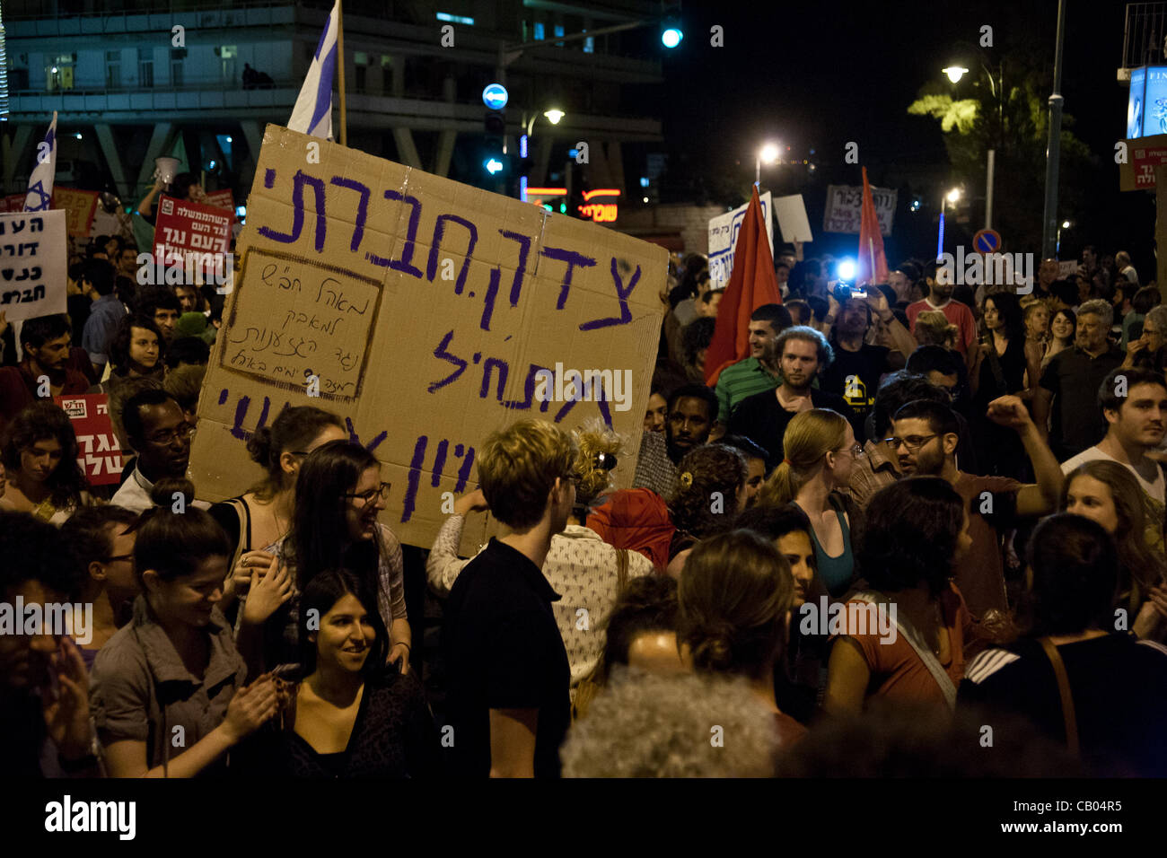 Protesters chant “The nations demands social justice!” recycling successful mottos of the 2011 summer social protests. Jerusalem, Israel. 12-May-2012. Stock Photo