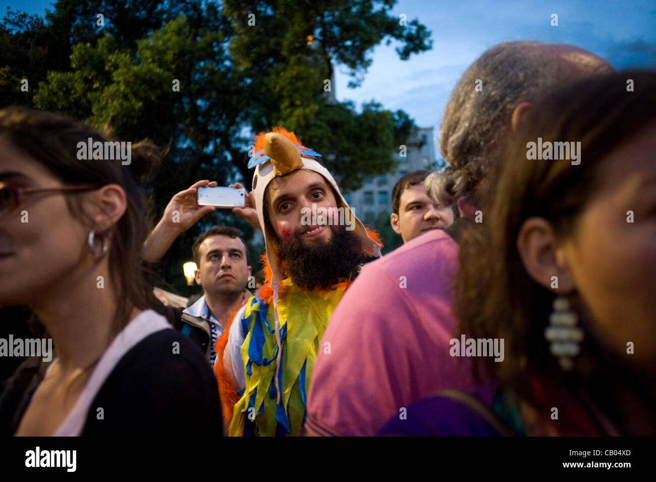 12 May, 2012-Barcelona, Spain. Man disguised as a bird during the march. On the anniversary of the indignant movement (born a year ago against the political and economic situation in Spain) thousands of people took to the streets recalling the same slogans with many allusions to the banks and the po Stock Photo