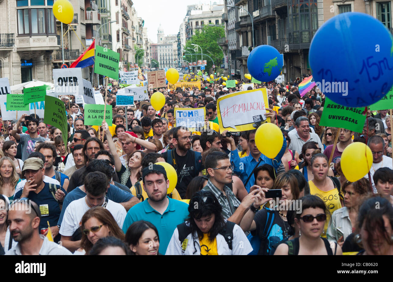 Barcelona, May 12, 2012. Thousands of people from the movement ' indignados' manifest themselves through the streets of downtown Barcelona to denounce the unjust economic policy of government in a show of force a year after his birth. The protests will continue until May 15, the anniversary of the Stock Photo