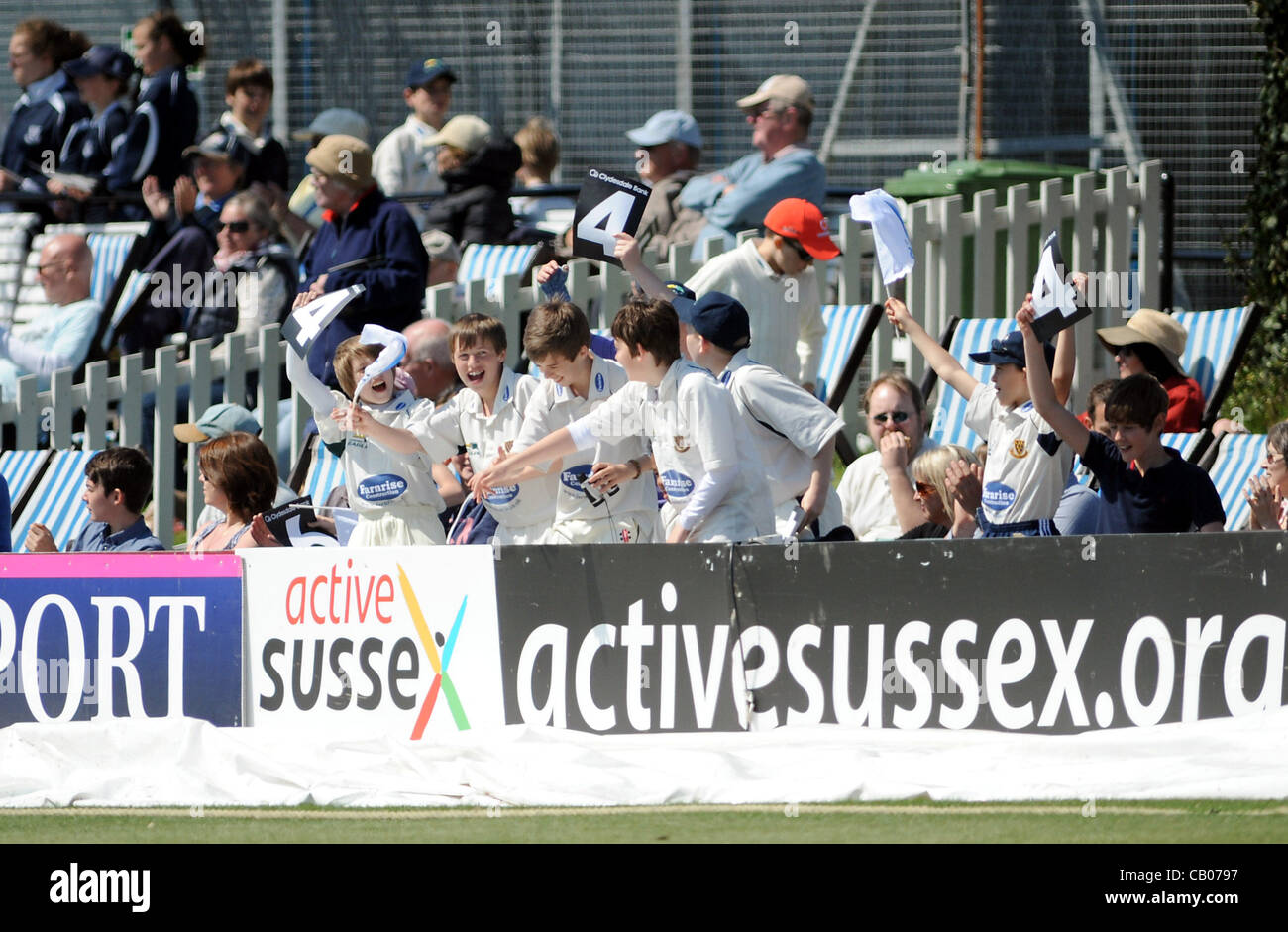 Sussex Sharks young fans celebrate another boundary against Unicorns in their Clydesdale Bank 40 League cricket match at the Probiz County Ground in Hove today UK Photograph taken by Simon Dack 13 May 2012 Stock Photo