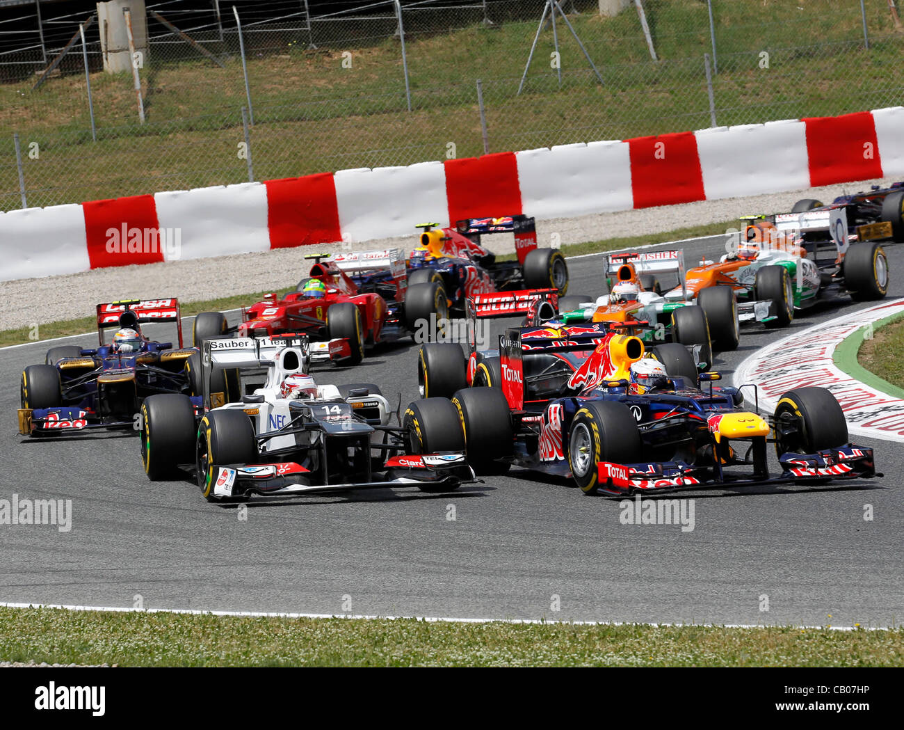 13.05.2012. Catalunya, Barcelona, Spain. F1 FIA Formula One World Championship  2012, Gran Prix in Barcelona Montmelo Sebastian Vettel , #14 Kamui  Kobayashi tight into the first corner Stock Photo - Alamy