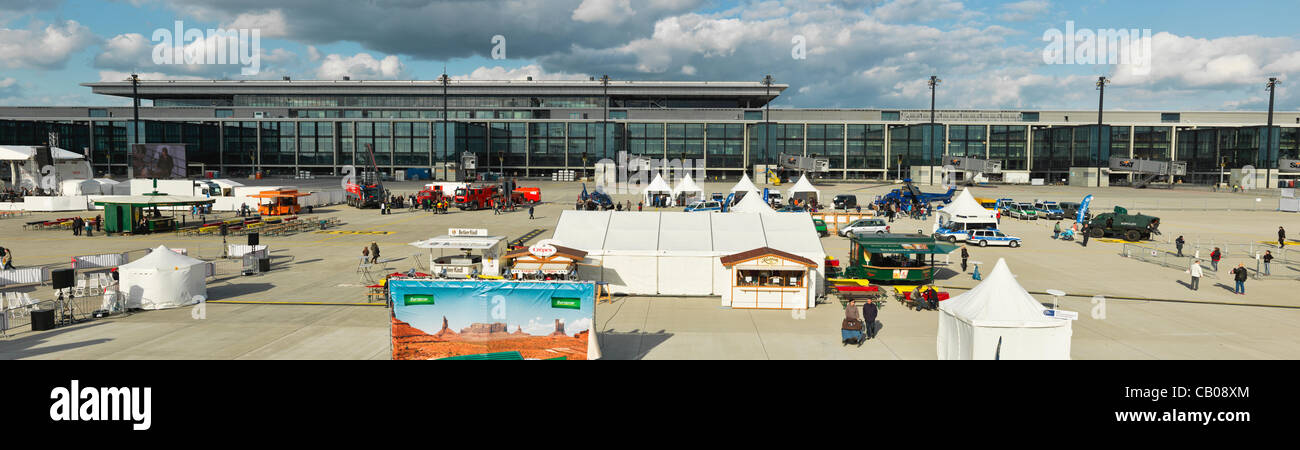 Panorama of New Berlin-Brandenburg Airport At Public Days with booths, stage and visitors. Low Clouds in the background, sunny light. High Resolution Hasselblad shot. Stock Photo