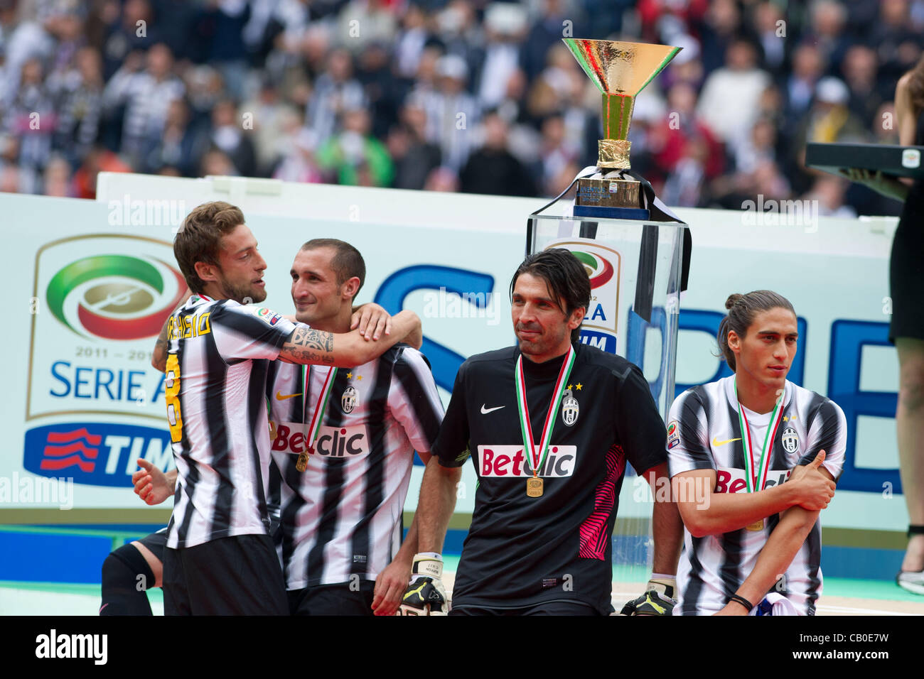 Juventus team group, MAY 13, 2012 - Football / Soccer : (L-R) Claudio Marchisio, Giorgio Chiellini, Gianluigi Buffon and Martin Caceres of Juventus celebrate as the trophy is seen at their back after the Italian 'Serie A' match between Juventus 3-1 Atalanta at Juventus Stadium in Turin, Italy. (Phot Stock Photo