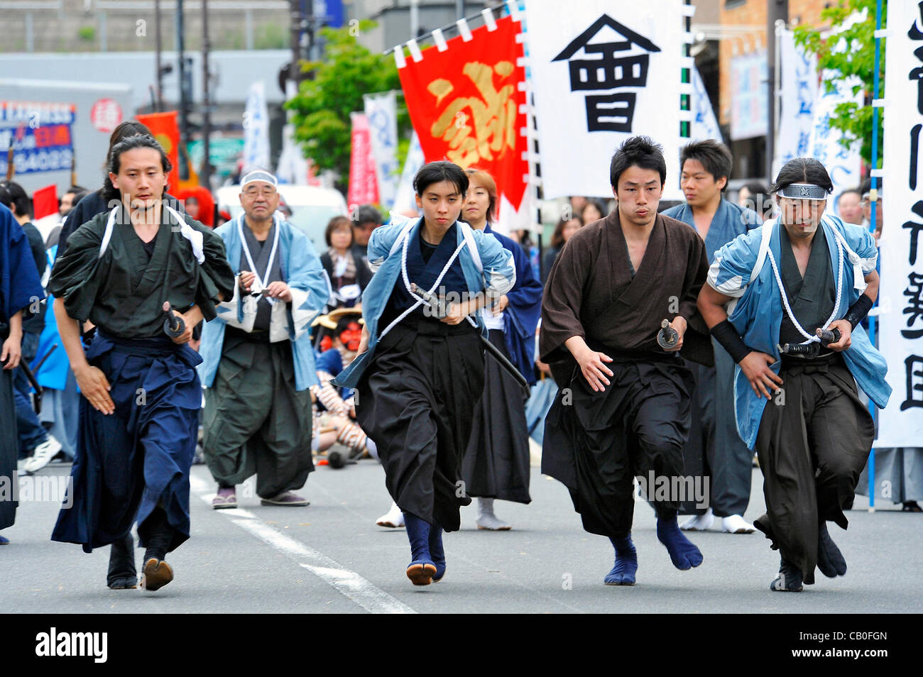 Tokyo, Japan - March 13: People in costumes of Shinsengumi, a group of Samurais of late 1800's, showed the spectators some famous scenes of battles that the group had as a part of Hino Shinsengumi Festival at Hino, Tokyo, Japan, on May 13, 2012. Since some of the members were born in this town, and  Stock Photo