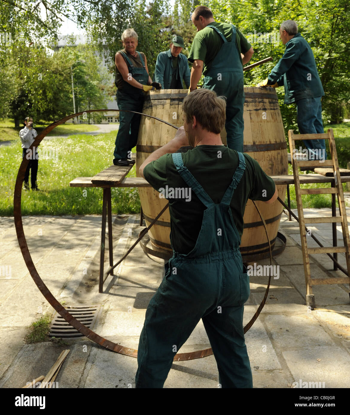 Coopers roll make a giant wooden barrel in the Pilsner Urquell brewery in Plzen (Pilsen) on May 15, 2012. The brewery still uses traditional woooden barrels for a small part of its production. (CTK Photo/Petr Eret) Stock Photo