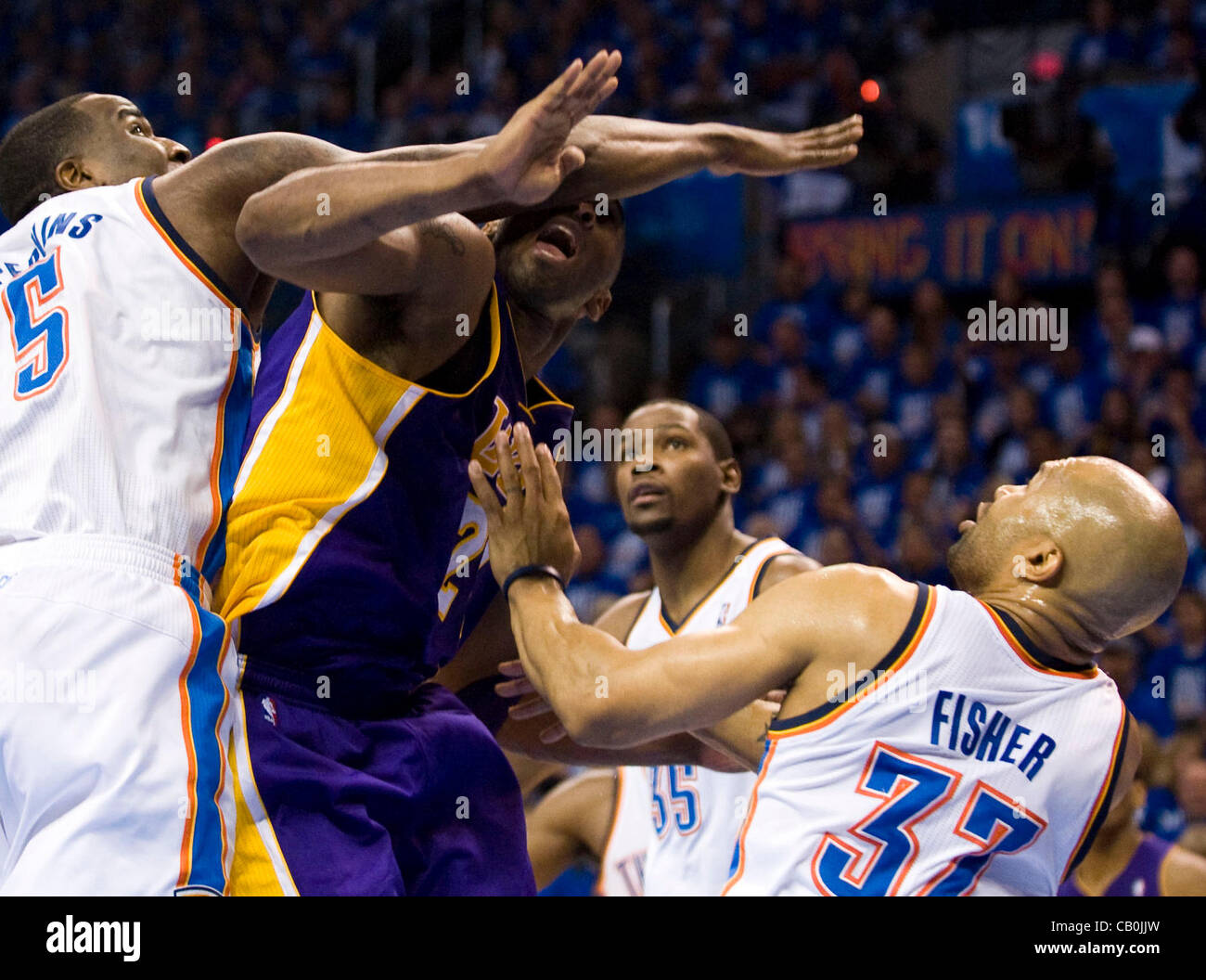 14.05.2012.  Oklahoma City, Oklahoma, U.S. - The Lakers' Kobe Bryant is fouled by the Thunder's Kendrick Perkins during the first half of Game 1 of the NBA Western Conference Semifinals Monday. The Thunder won game 1 by a score of 119-90 Stock Photo