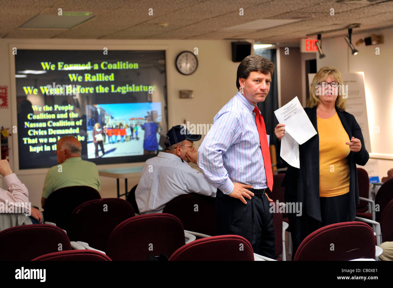 Speaking against Nassau County Executive’s Plan to Privatize Sewage Treatment Plants are County Legislator Dave Denenberg (Democrat) at left, and civic leader Claudia Borecky, at right, on Wednesday, May 16, 2012, at Bellmore Library, New York, USA. Borecky, a member of We the People Save our Waters Stock Photo