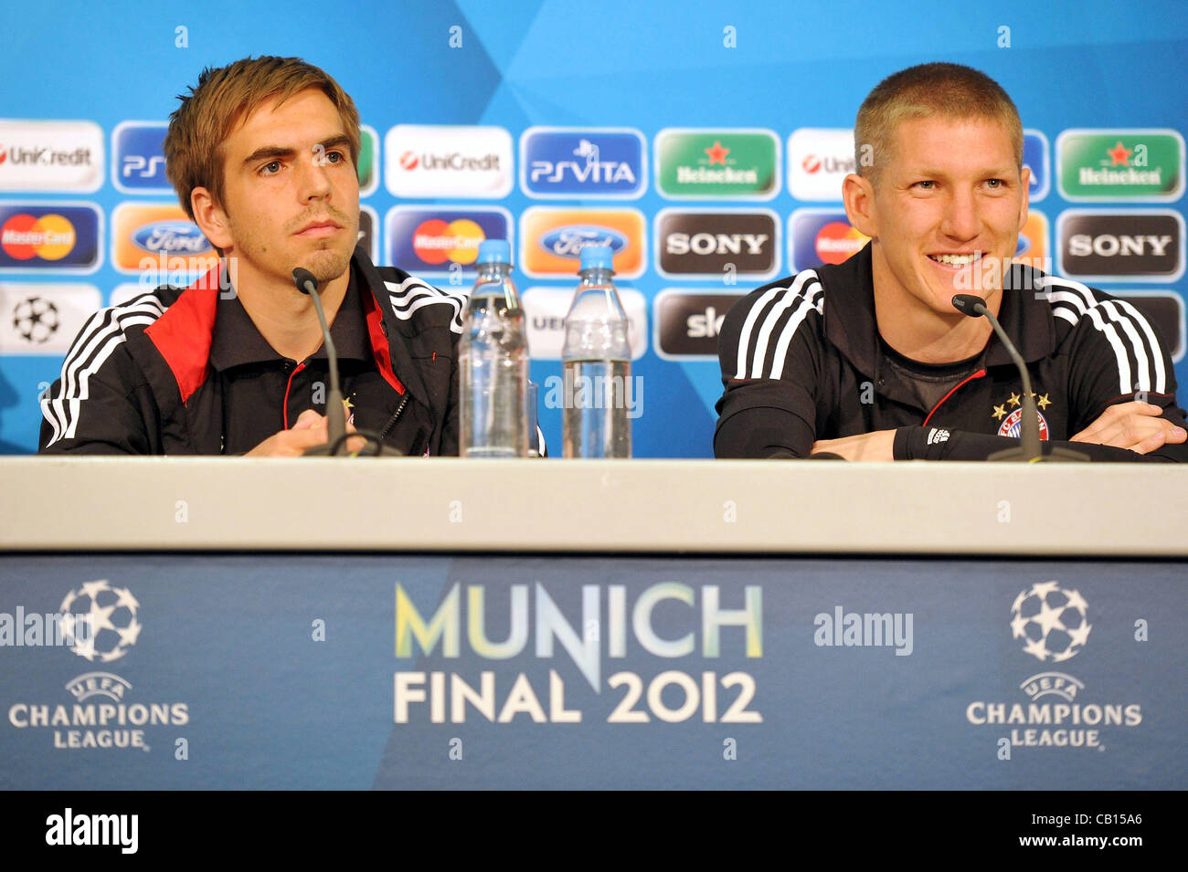 18 05 2012 Munich Germany Philipp Lahm L And Bastian Schweinsteiger Look On During The Fc Bayern Muenchen Press Conference Ahead Of The Uefa Champions League Final Between Fc Bayern Muenchen And Chelsea On May