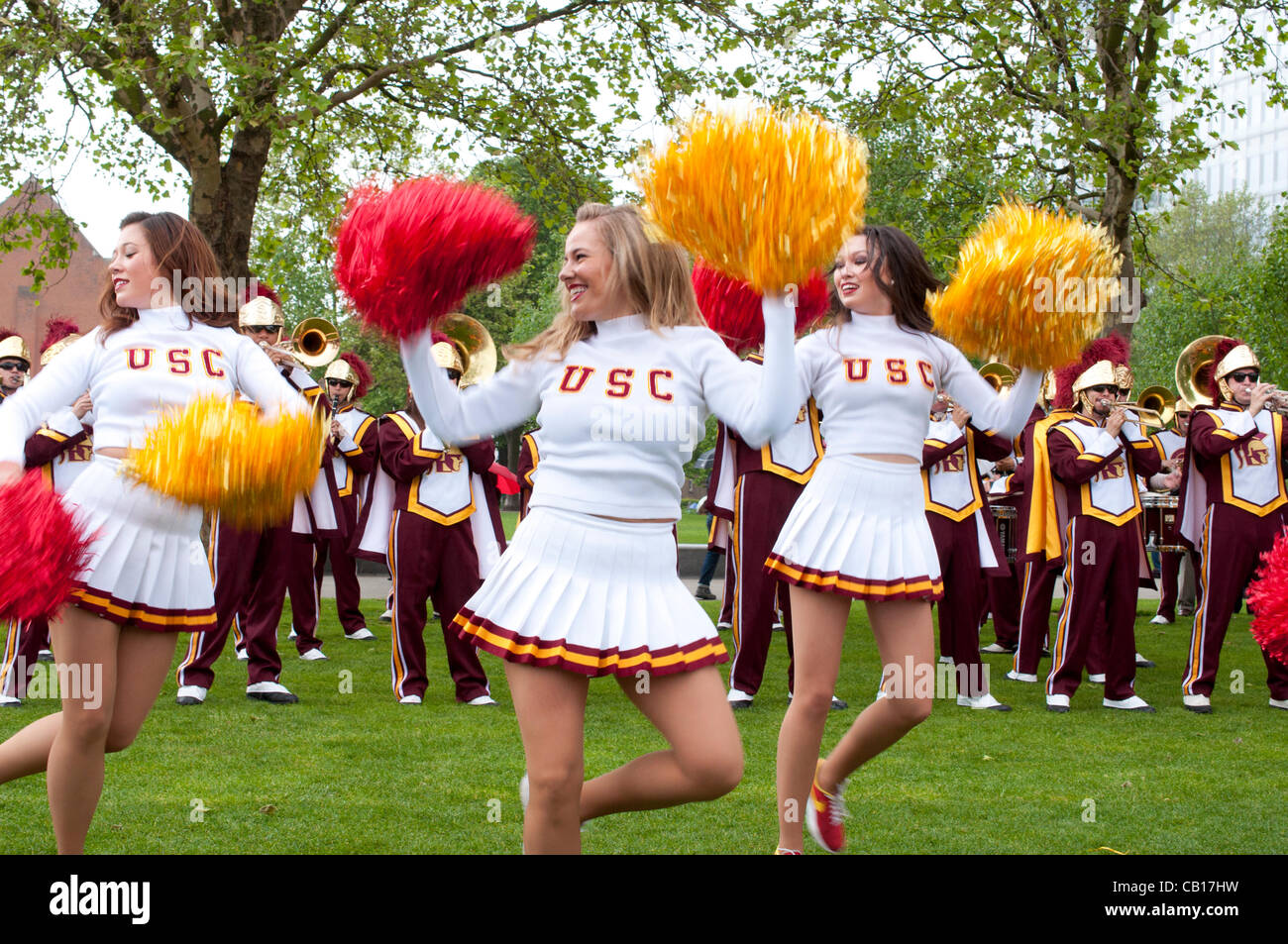 18 May 2012 London UK, Cheerleaders perform in front of The University of Southern California Trojans Marching Band Stock Photo