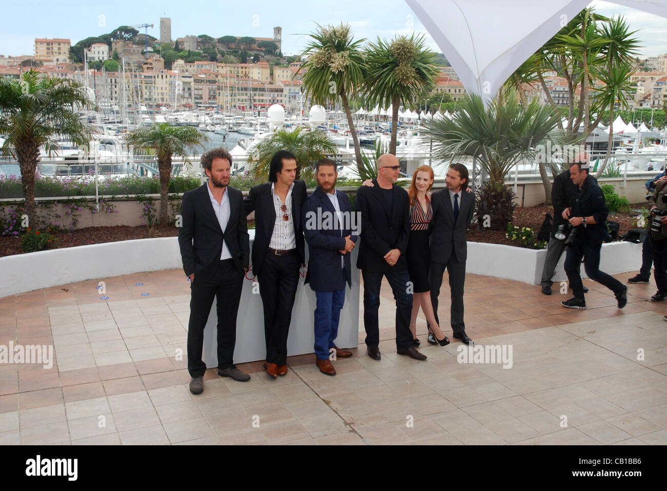 May 19, 2012 - Cannes, France - CANNES, FRANCE - MAY 19: (L-R) Actor Jason Clarke, screenwriter Nick Cave, actor Tom Hardy, director John Hillcoat, actress Jessica Chastain and actor Shia LaBeouf attend the 'Lawless' Photocall during the 65th Annual Cannes Film Festival at Palais des Festivals on Ma Stock Photo