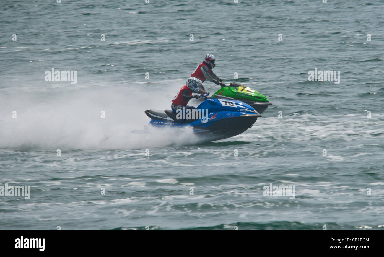 A P1 jet ski racer, speeds across Plymouth Sound during the first day ...