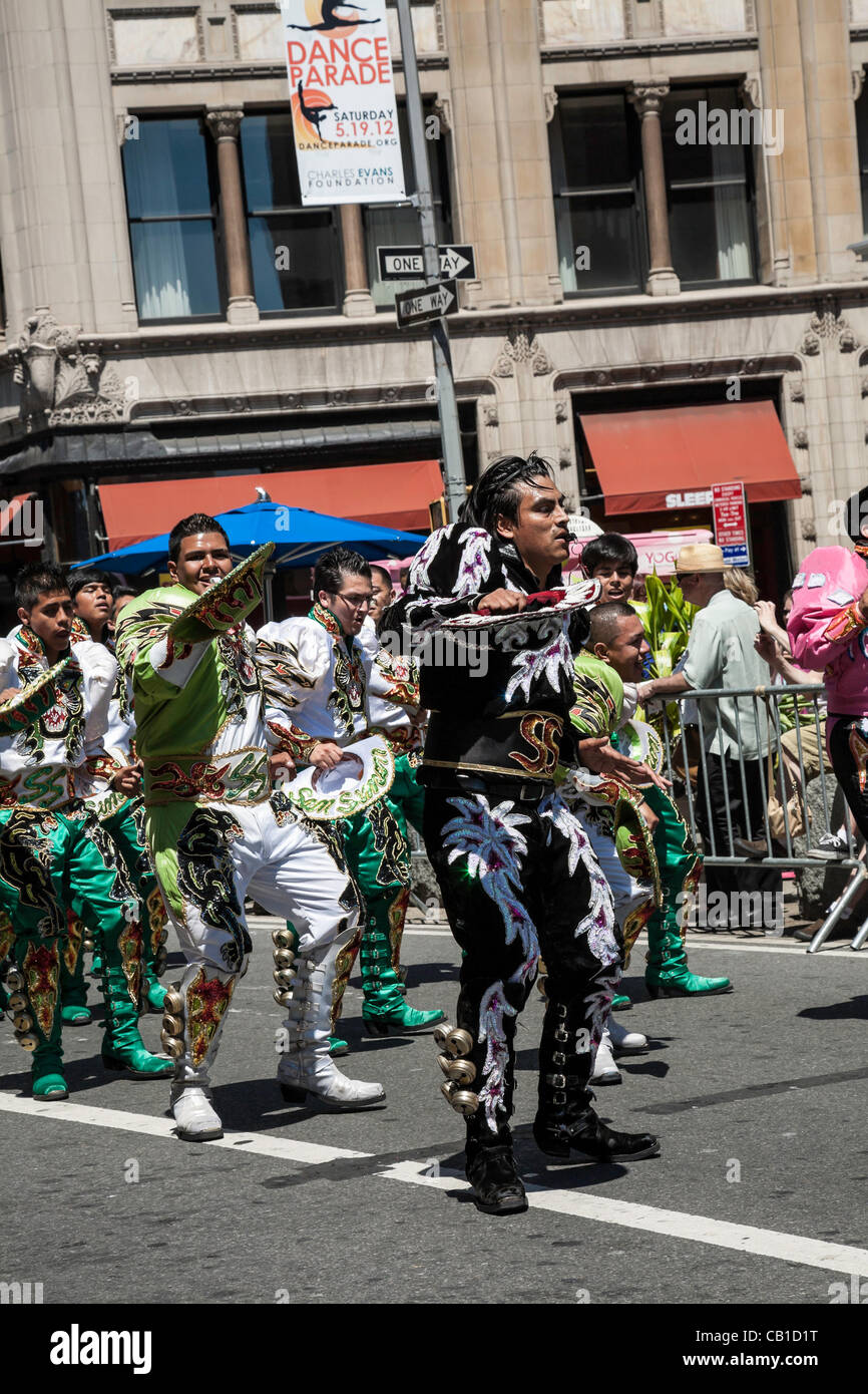 New York, USA. 19 May, 2012. The Dance Parade showcases almost 80 different dance genres and cultures. The Caporales “San Simon” dancers, perform in traditional Bolivian costumes. Stock Photo