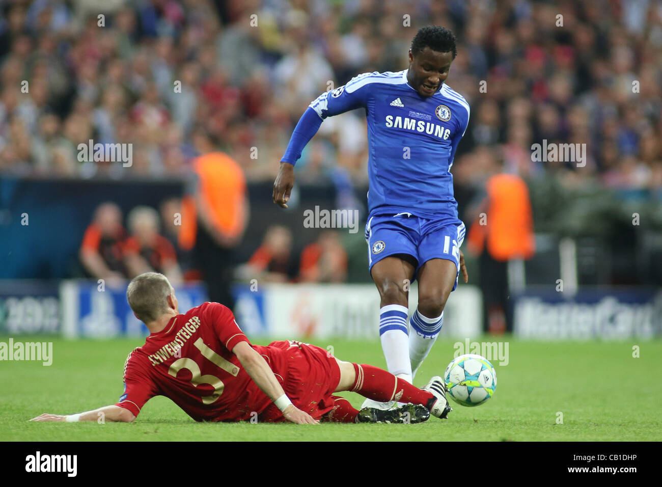 19/05/2012 Munich, Germany. Bayern's German midfielder Bastian Schweinsteiger  and Chelsea's Nigeria midfielder John Obi Mikel in action during the 2012 UEFA Champions League Final played at the Allianz Arena Munich, and contested by Englnd's Chelsea and Germany's Bayern Munich. Mandatory credit Mit Stock Photo
