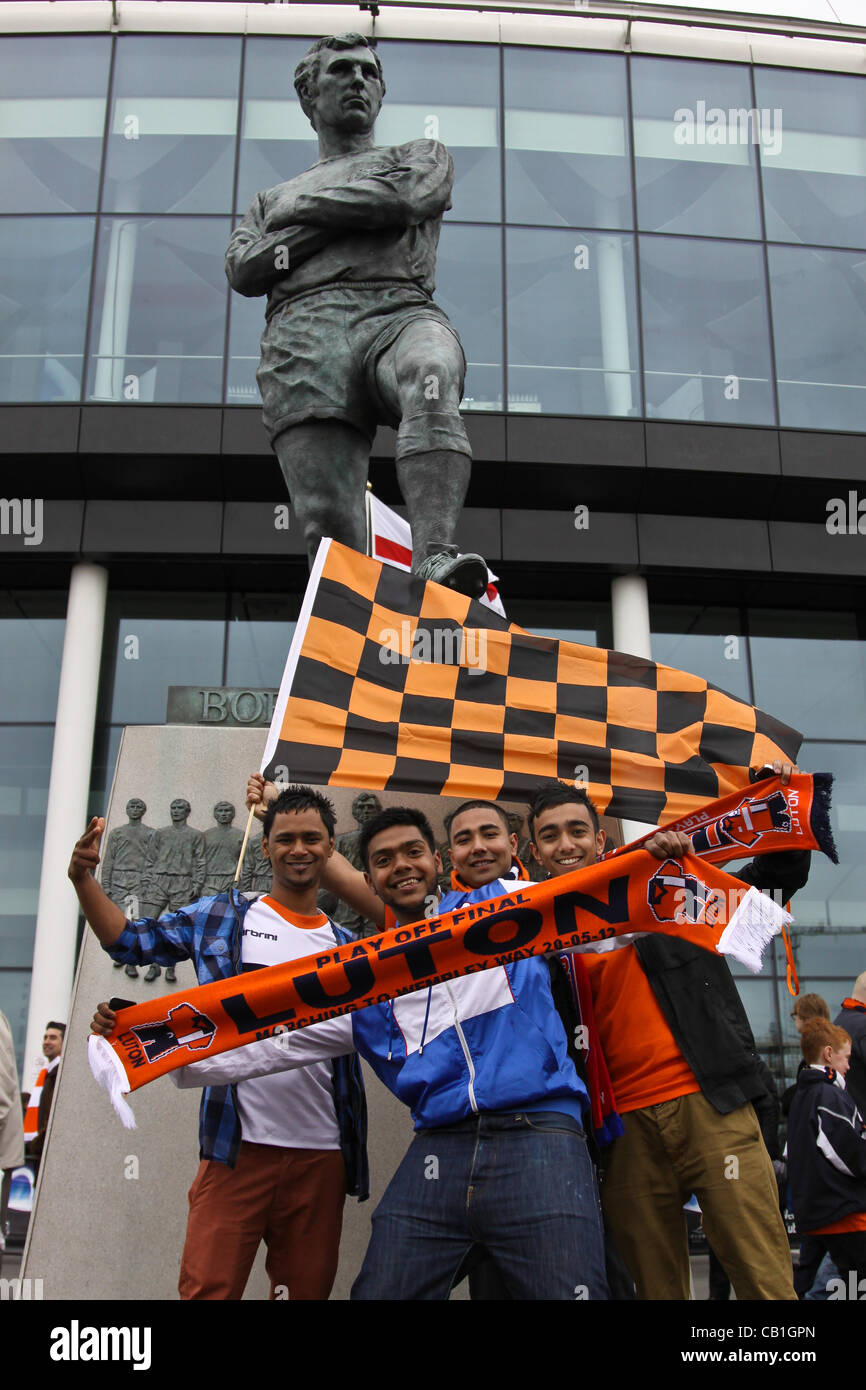 LONDON, ENGLAND - MAY 20: 2011-12 Luton fans in front of the Bobby Moore statue, captain of England's World Cup winning team in 1966, before the Blue Square Bet Conference League promotion final between Luton Town FC and York City FC at Wembley Stadium on May 20, 2012 in London, England. (Photo by D Stock Photo