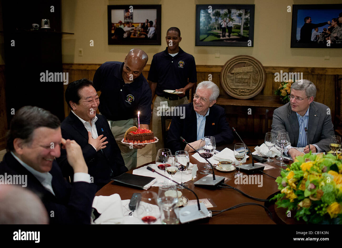 A chocolate cake is presented to Prime Minister Yoshihiko Noda of Japan to celebrate his May 20 birthday during a G8 Summit working dinner in Laurel Cabin May 18, 2012 at Camp David, Maryland. Seated, from left, are José Manuel Barroso, President of the European Commission, Prime Minister Mario Mont Stock Photo