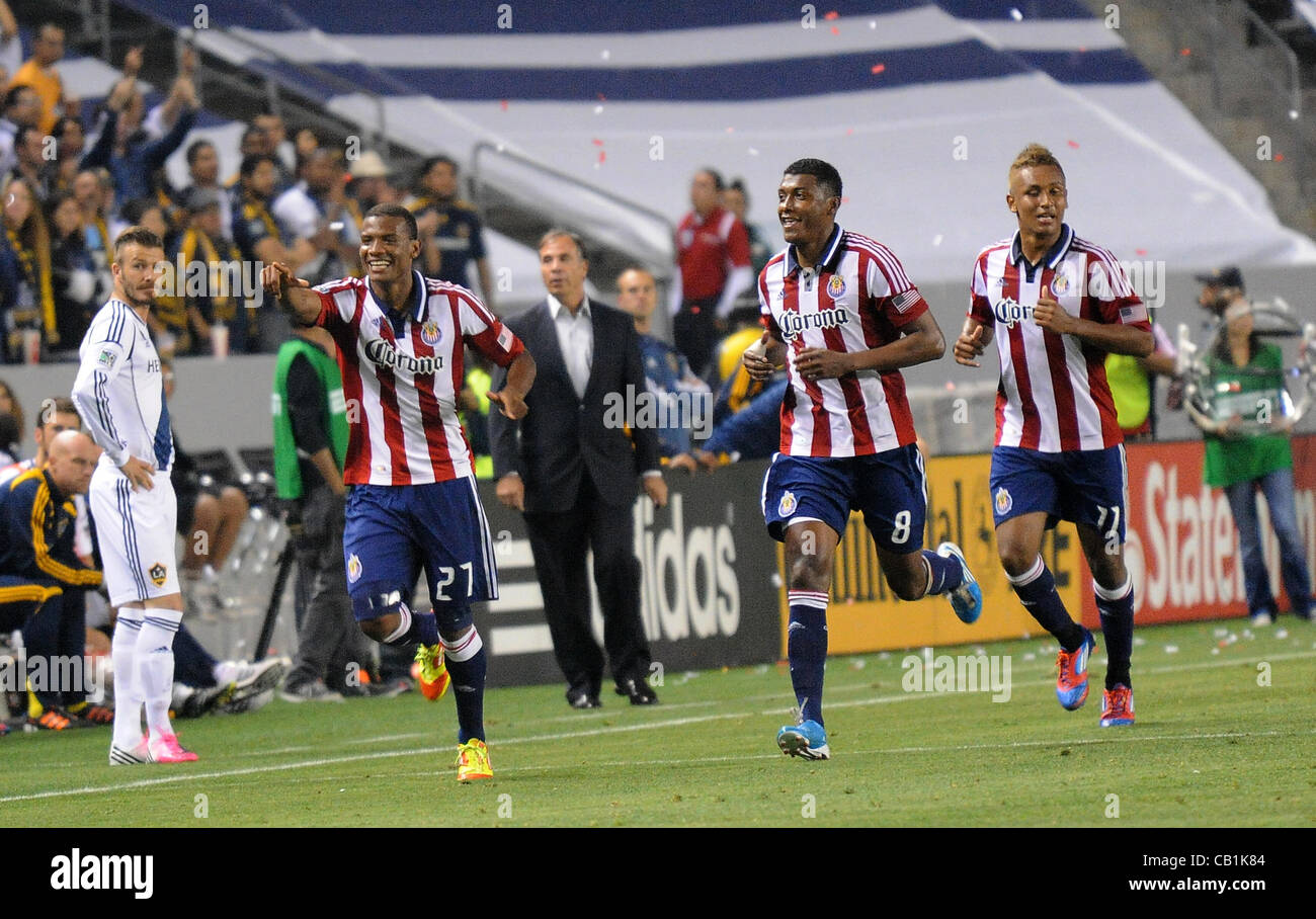 May 20, 2012 - Carson, California, USA - Major League Soccer-MLS-CHIVAS USA defeats the LOS ANGELES GALAXY 1 to 0 at the Home Depot Center, Saturday,  May 19, 2012. Chivas USA players JOSE CORREA (27), MINDA OSWALDO (8), and JUAN AGUDELO (11),  celebrate the only goal of the game as DAVID BECKHAM lo Stock Photo