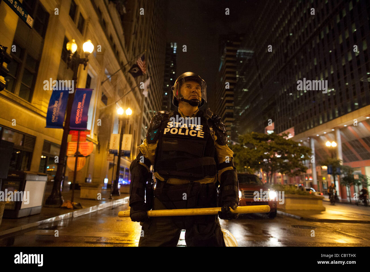 An Lllinois State Police officer in roit gear blockimg streets as anti ...