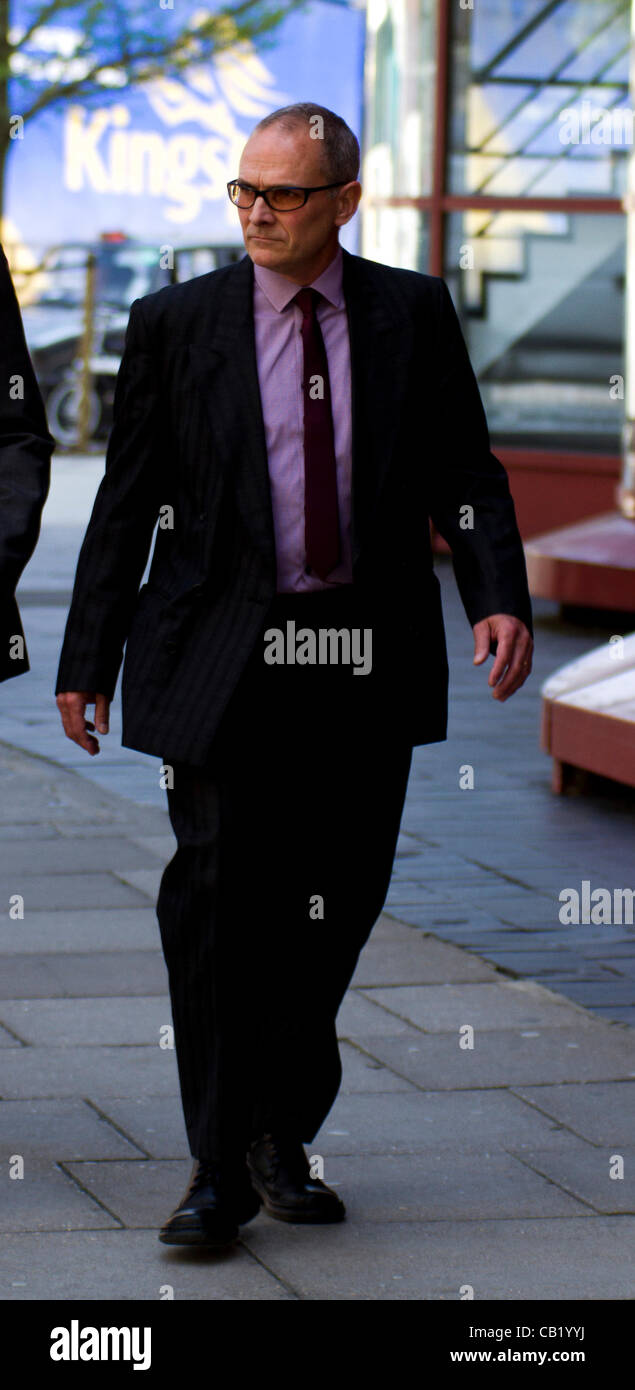 London, UK. 22nd May 2012. PC Alex MacFarlane leaves Westminster Magistrates Court, London. PC Alex MacFarlane allegedly racially abused a black man during last summer's riots. Stock Photo