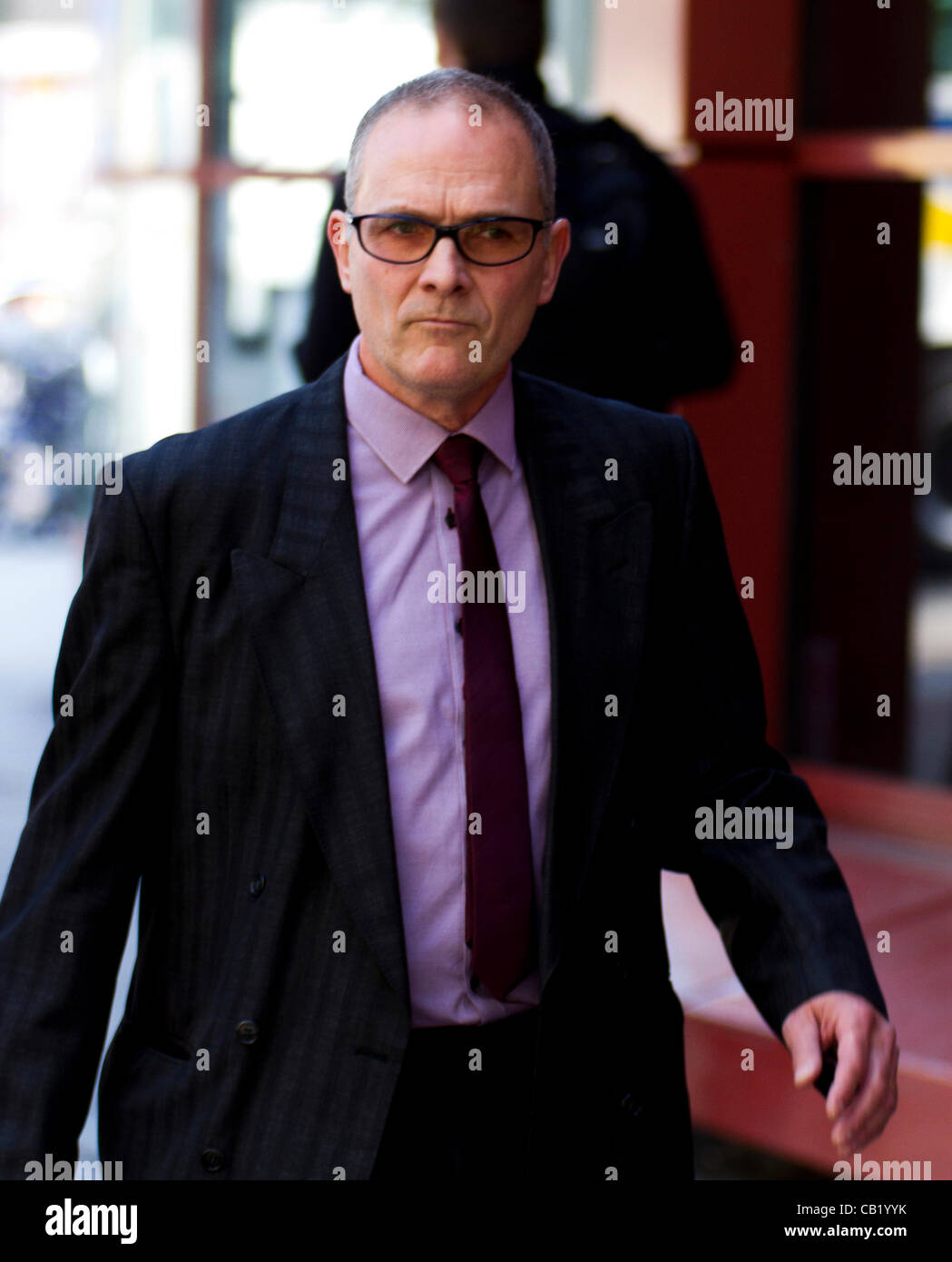 London, UK. 22nd May 2012. PC Alex MacFarlane leaves Westminster Magistrates Court, London. PC Alex MacFarlane allegedly racially abused a black man during last summer's riots.PLEASE NOTE NAME SPELLING HAS BEEN CORRECTED FROM PREVIOUS. Stock Photo