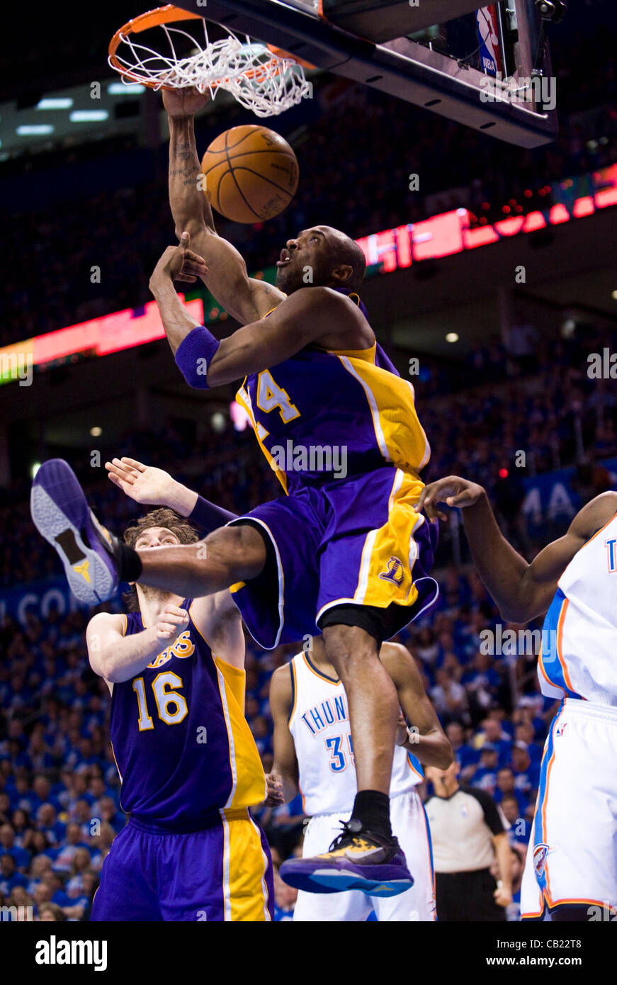 Kobe Bryant of the Los Angeles Lakers goes for a reverse slam dunk
